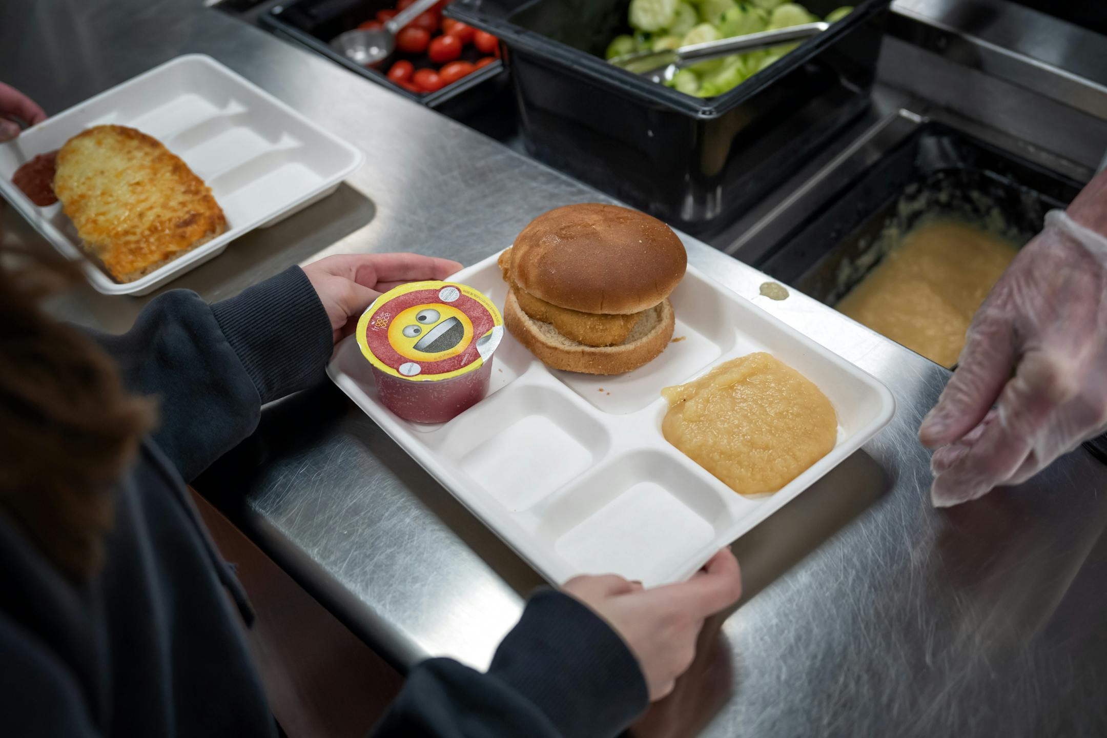 Fifth graders ate school lunch at Champlin-Brooklyn Park Academy on Friday, Feb. 17, 2023 in Champlin, Minn.