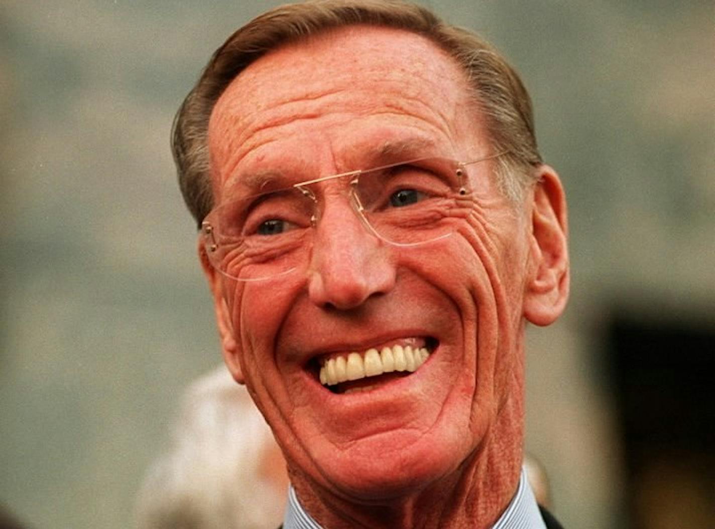 FILE -- Charles Keating Jr., who was convicted in the 1980s Savings and Loan scandal, smiles as he talks with the media outside the Federal Courthouse in Los Angeles on Dec. 2, 1996.