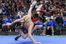 Chase Mills of St. Michael-Albertville takes down Stillwater's Mikey Jelinek in a 106 LB bout during the Class 3A Minnesota High School Wrestling Team