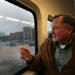 Roger Scherer, photographed riding the then-new Northstar commuter rail line in 2009, was a Metropolitan Council member.