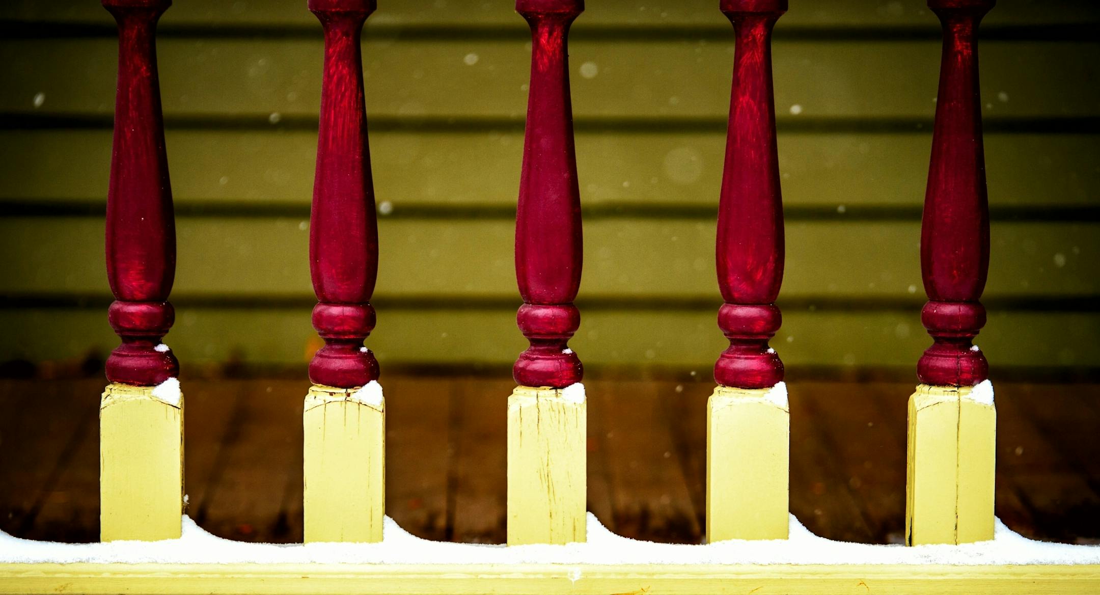 Brightly colored porch railing on a Milwaukee Avenue home.