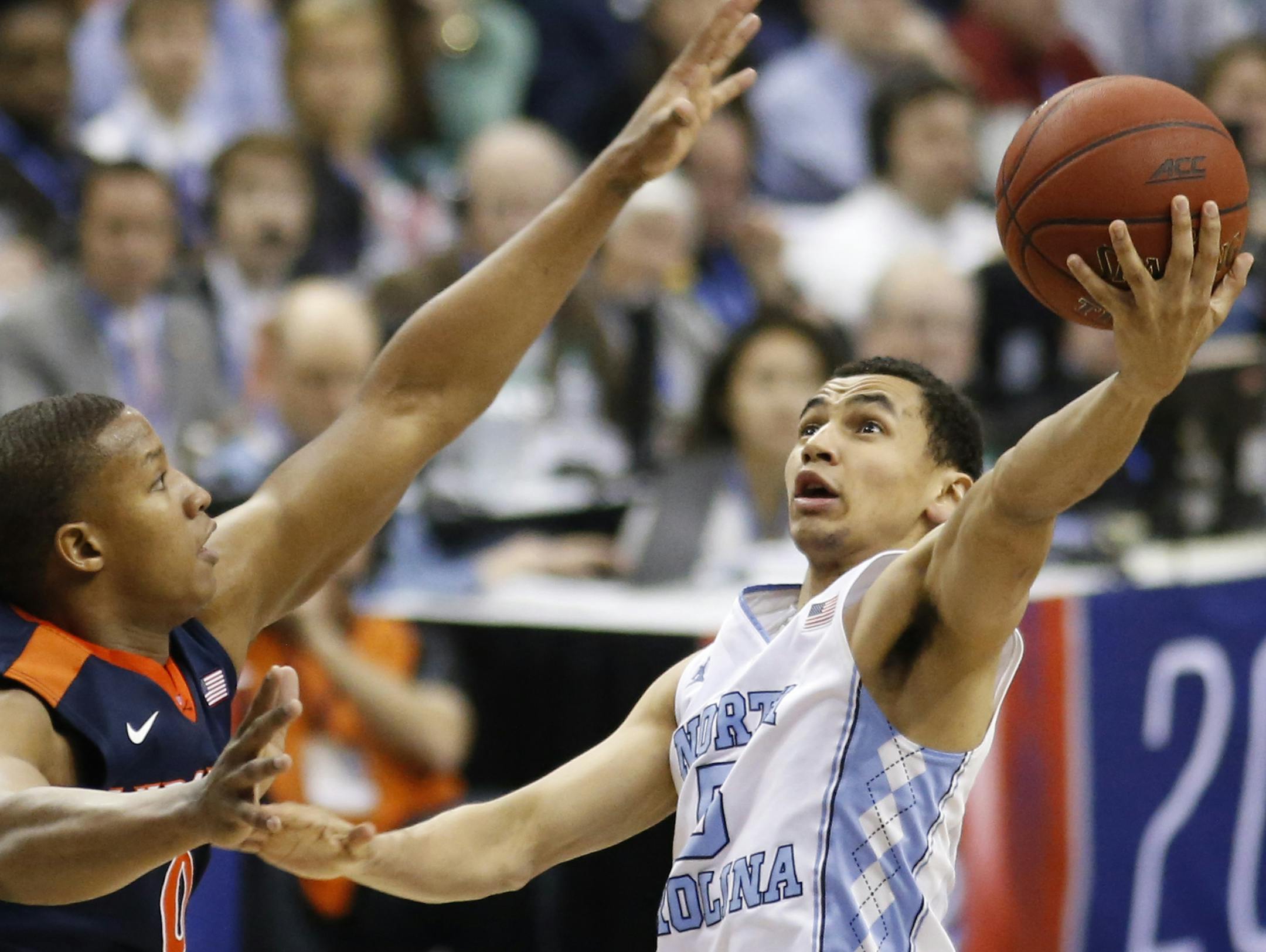 North Carolina guard Marcus Paige shoots against Virginia guard Devon Hall during the second half of an NCAA college basketball game for the championship of the Atlantic Coast Conference men's tournament, Saturday, March 12, 2016, in Washington. North Carolina defeated Virginia 61-57. (AP Photo/Steve Helber) ORG XMIT: VZN204