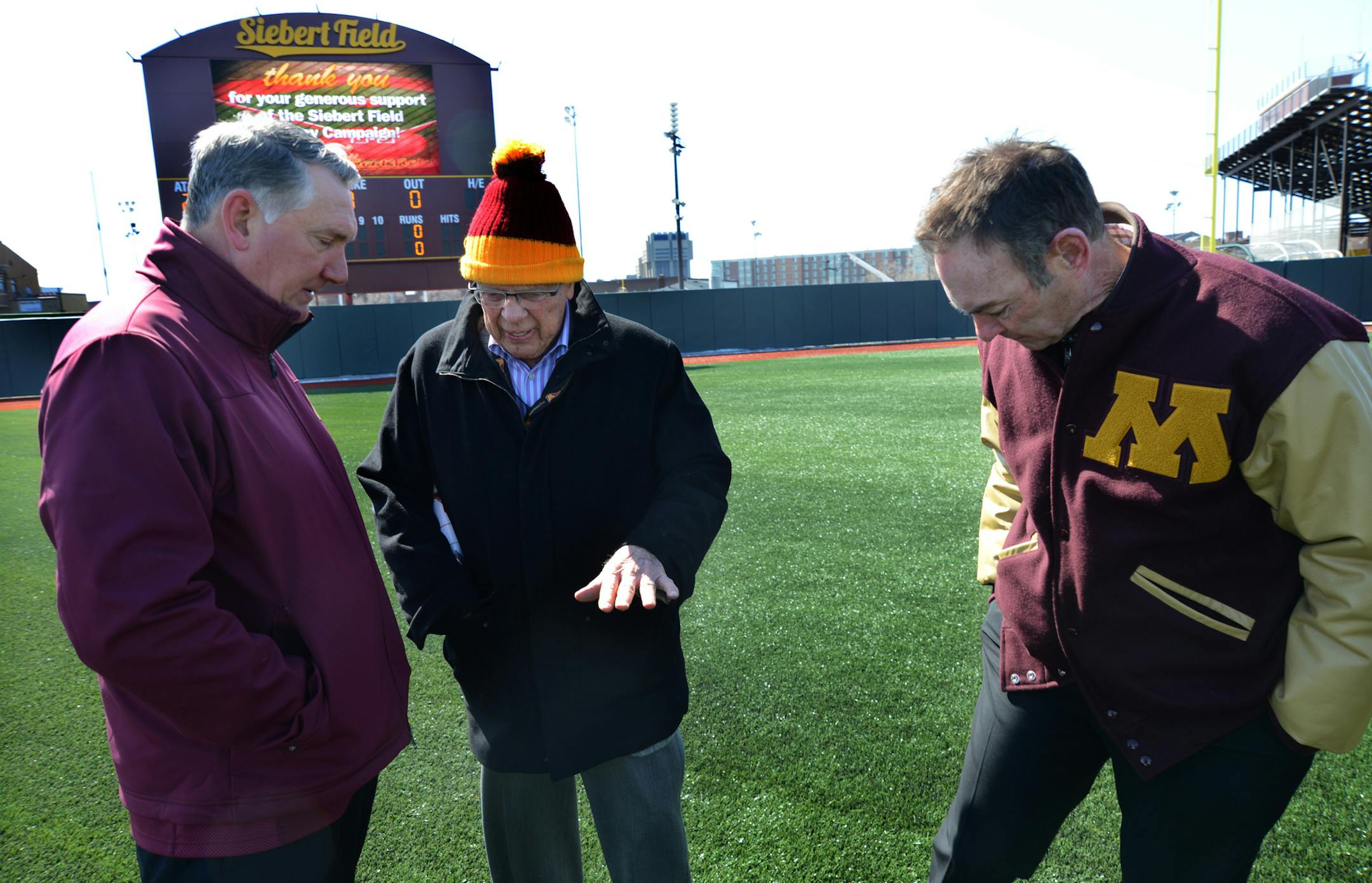 Siebert Field had a grand opening on Tuesday, afternoon April, 2 2013. Dick Jonckowski, the Gopher's announcer was the emcee for the dedication event. From left to right U of M head baseball coach John Anderson, Wheelock Whitney and Gopher alum Paul Molitor checked out the new turf. The new surface is mondo sport turf except for home plate and the pitchers mound, which are clay.] Richard.Sennott@startribune.com Richard Sennott/Star Tribune. , Minneapolis Minn. Tuesday 4/2/13) ** (cq)