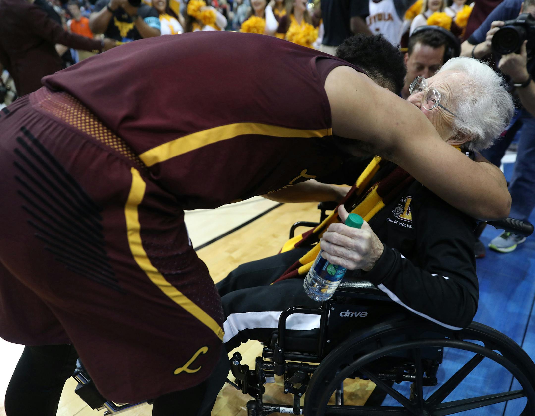 Loyola Ramblers guard Marques Townes (5) hugs Sister Jean Dolores Schmidt after a 63-62 win over the Tennessee Volunteers in the second round of the NCAA tournament at American Airlines Center on Saturday, March 17, 2018, in Dallas, Texas. (John J. Kim/Chicago Tribune/TNS)