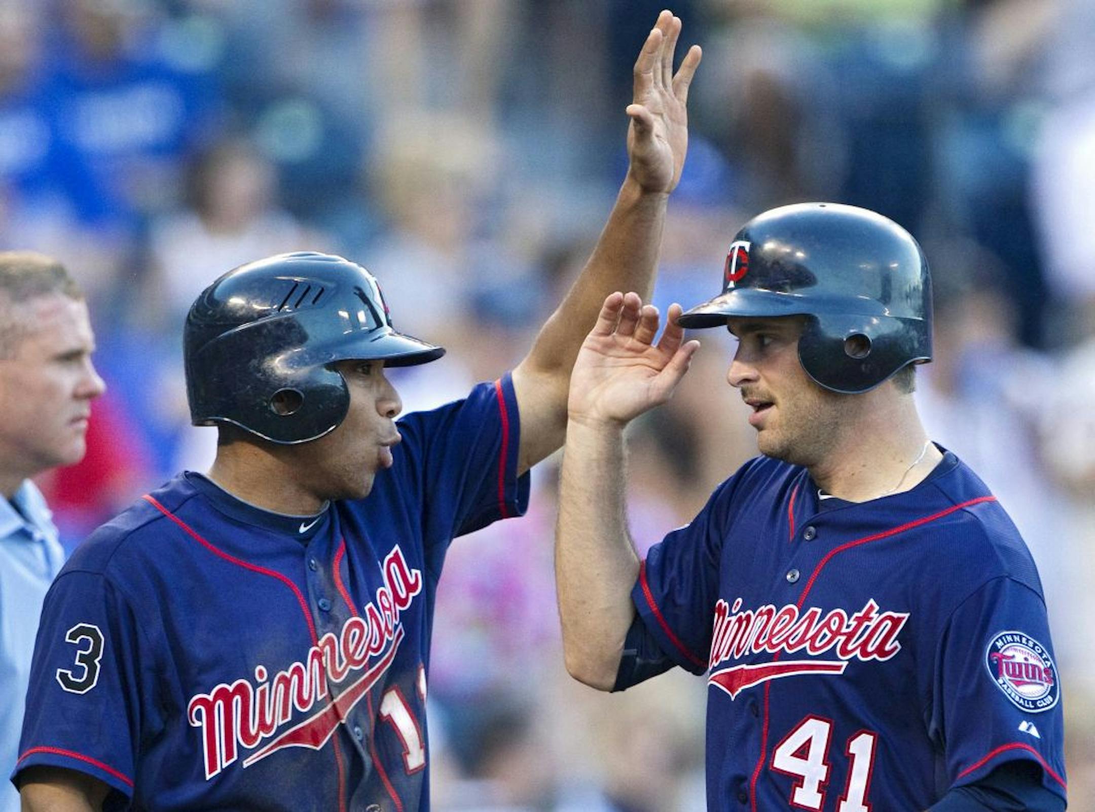 Minnesota Twins' Ben Revere and Drew Butera (41) last week in Kansas City