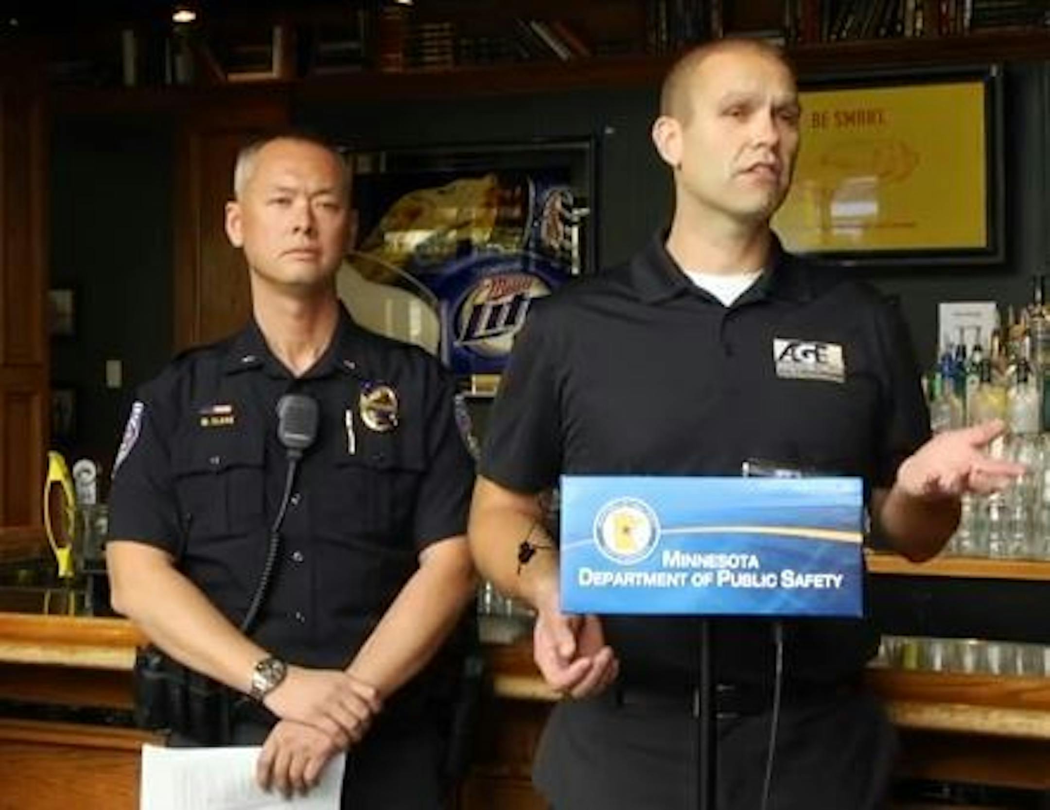 University of Minnesota Police Chief Matt Clark, left, and Terry Kelley, a special agent with the Minnesota Department of Public Safety's Alcohol and Gaming Enforcement division, spoke Monday at the Library bar in Minneapolis.