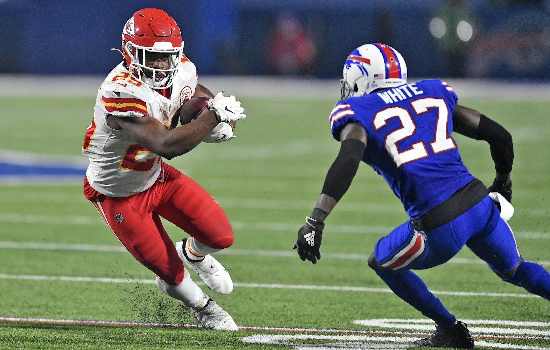 Kansas City Chiefs running back Clyde Edwards-Helaire (25) runs the ball as Buffalo Bills cornerback Tre'Davious White (27) defends during the second half of an NFL football game, Monday, Oct. 19, 2020, in Orchard Park, N.Y. (AP Photo/Adrian Kraus)