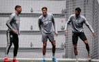New Zealand natives and Minnesota United teammates Michael Boxall (15), Noah Billingsley (2) and James Musa (41) stretched during a practice last Frid