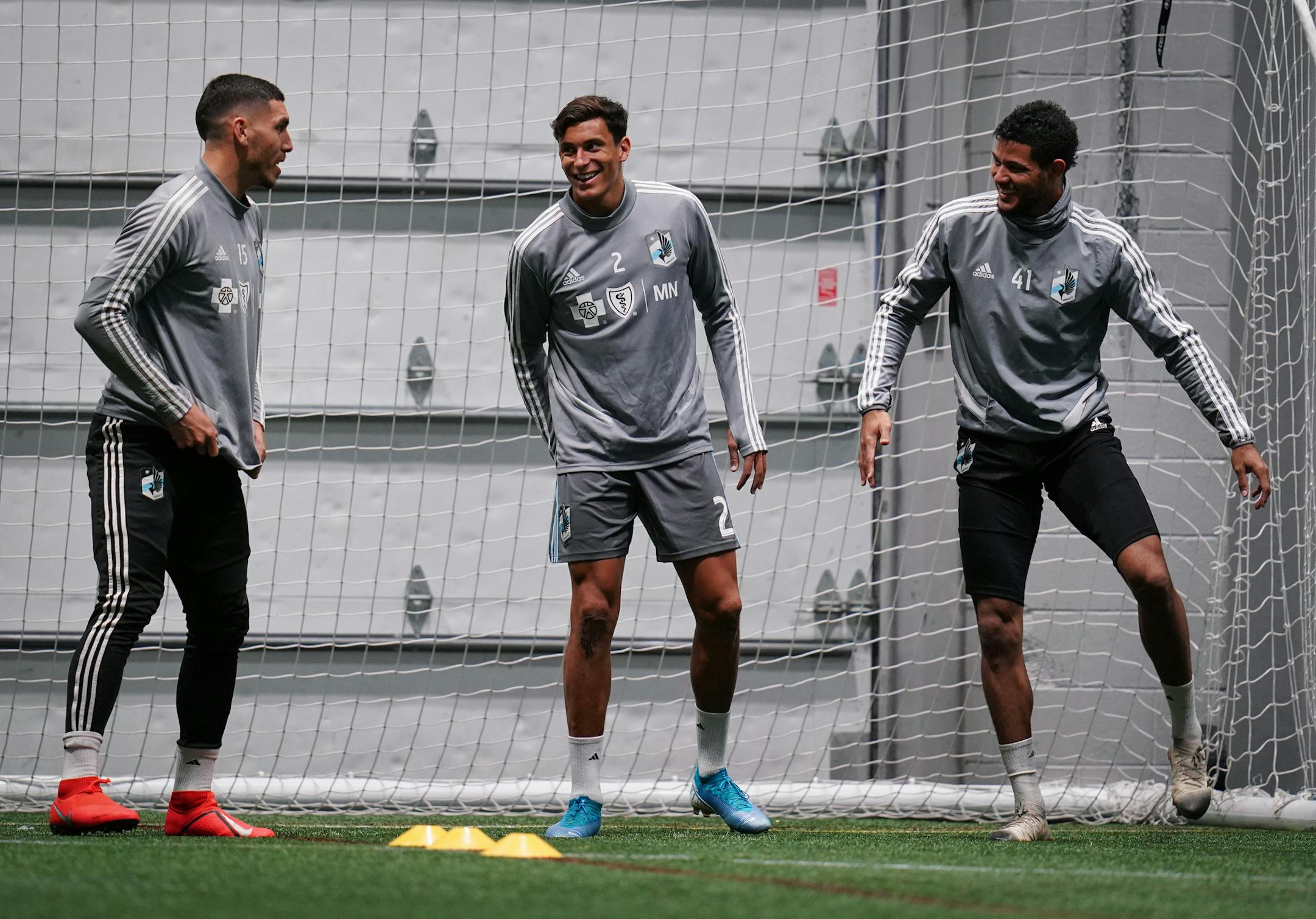 New Zealand natives and Minnesota United teammates Michael Boxall (15), Noah Billingsley (2) and James Musa (41) stretched during a practice last Friday at the National Sports Center in Blaine.