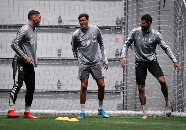 New Zealand natives and Minnesota United teammates Michael Boxall (15), Noah Billingsley (2) and James Musa (41) stretched during a practice last Frid
