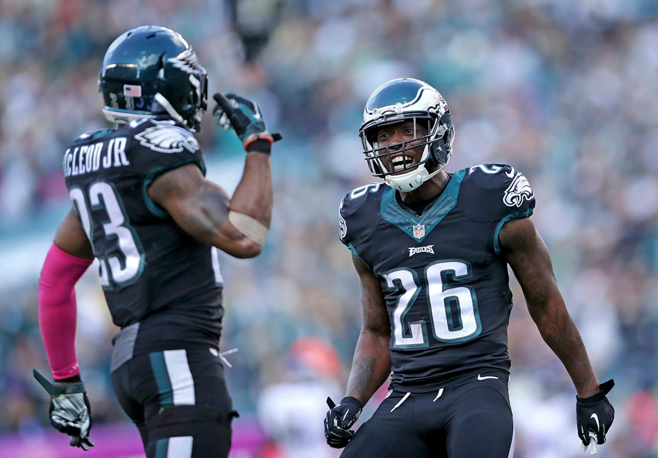 Eagles Rodney McLeod (left) and Jaylen Watkins celebrate after stopping the Vikings on 4th and goal in the 4th quarter.