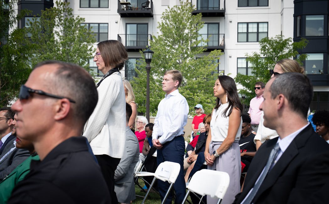 Ruth Lande, left, stood along with representatives of Minnesota hospitals and medical networks, as St. Paul Mayor Melvin Carter announced a new program to help erase medical debt on Aug. 10.