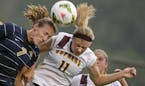 Gophers women's soccer player Josee Stiever (11) and Marquette University's Morgan Proffitt (7) try to head the ball during their game at Elizabeth Ly