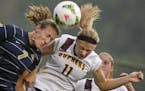 Gophers women's soccer player Josee Stiever (11) and Marquette University's Morgan Proffitt (7) try to head the ball during their game at Elizabeth Ly