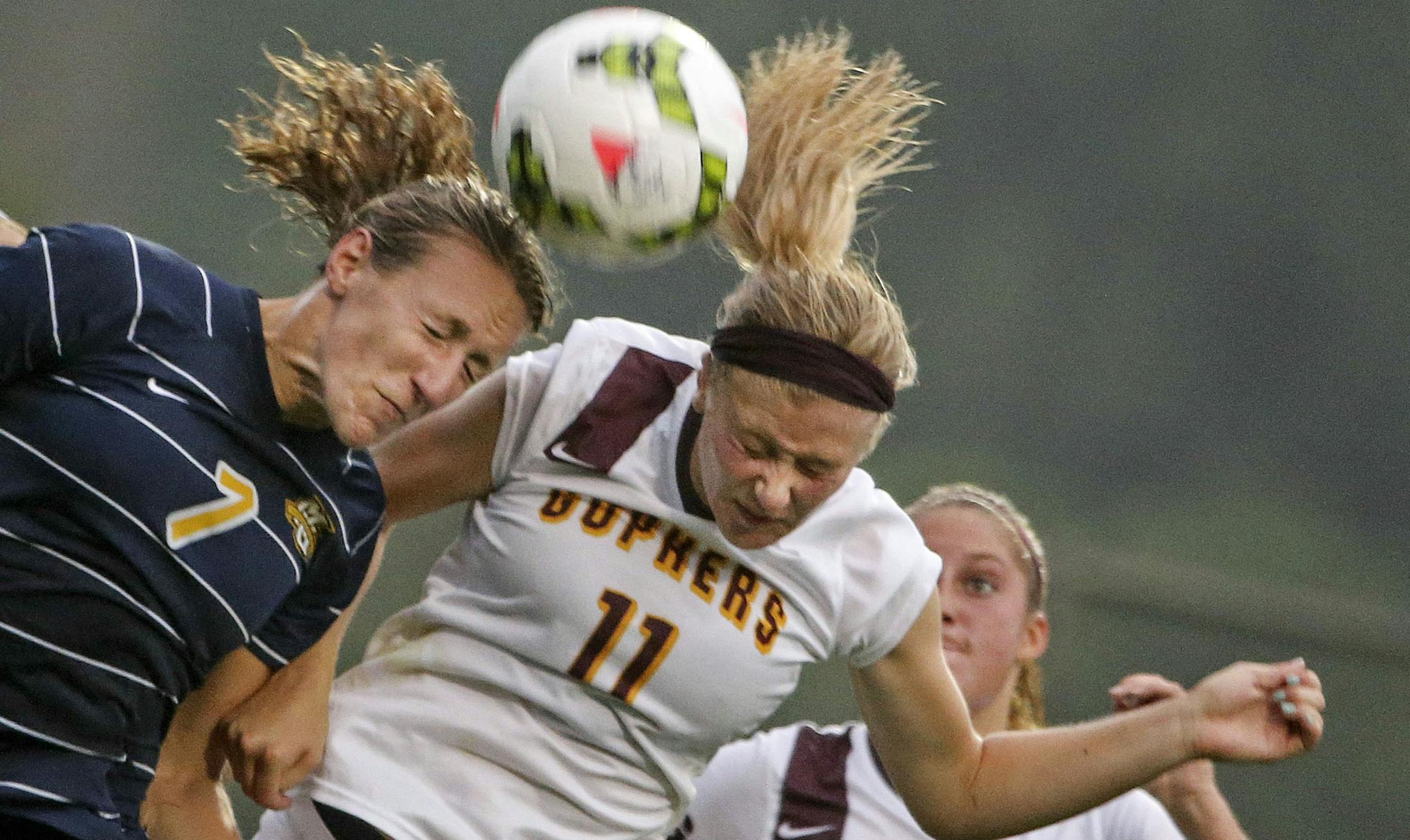 Gophers women's soccer player Josee Stiever (11) and Marquette University's Morgan Proffitt (7) try to head the ball during their game at Elizabeth Lyle Robbie Stadium Friday Aug. 29, 2014, in St. Paul, MN.] (DAVID JOLES/STARTRIBUNE)djoles@startribune.com Gophers vs. Marquette in women's soccer. Gophers women's soccer feature on Simone Kolander. She was Big Ten offensive player of the week for the first week of the season: tallying nine points with a combined two goals and five assists against S