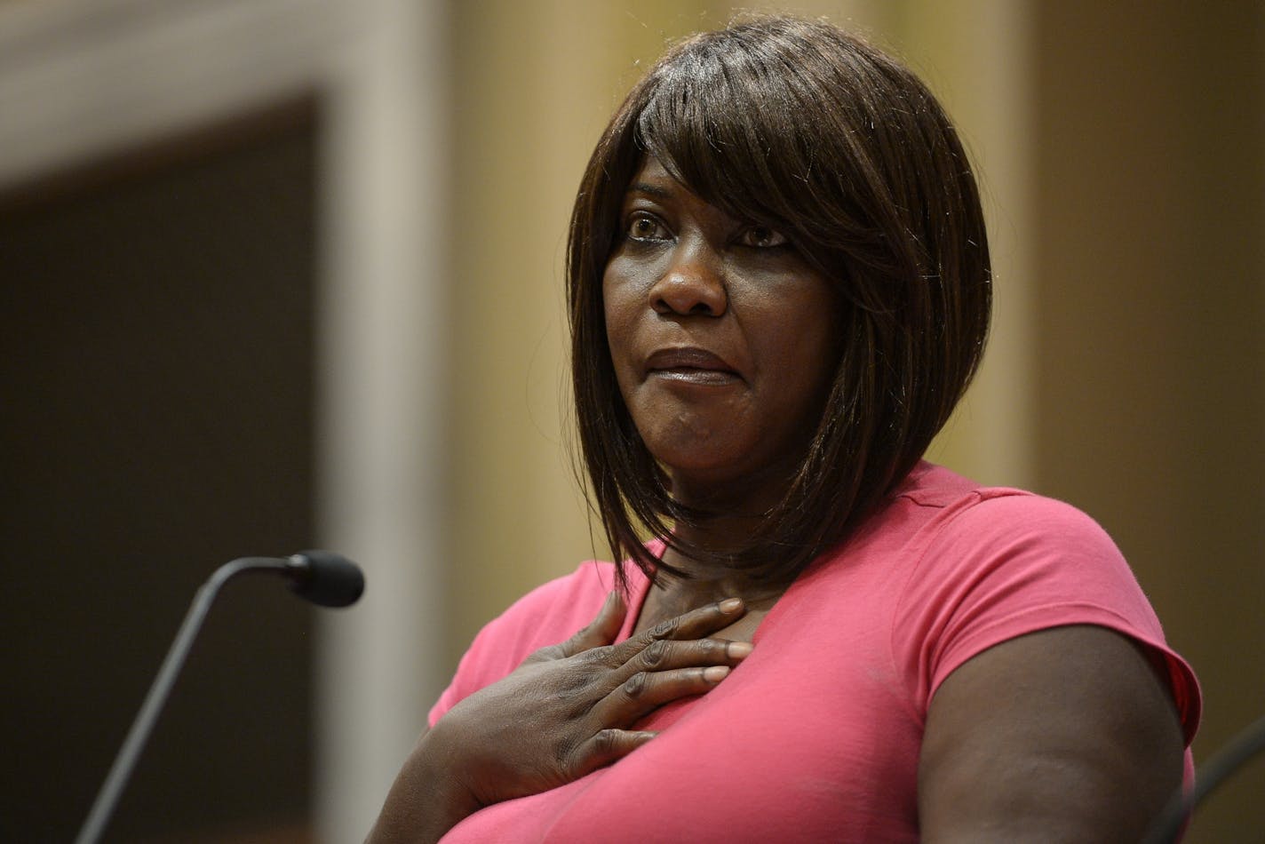 Minister Toya Woodland fought back tears as she made remarks concerning the Minneapolis Police Department's draft report on forced Ketamine use at Thursday's public safety meeting at Minneapolis City Hall.