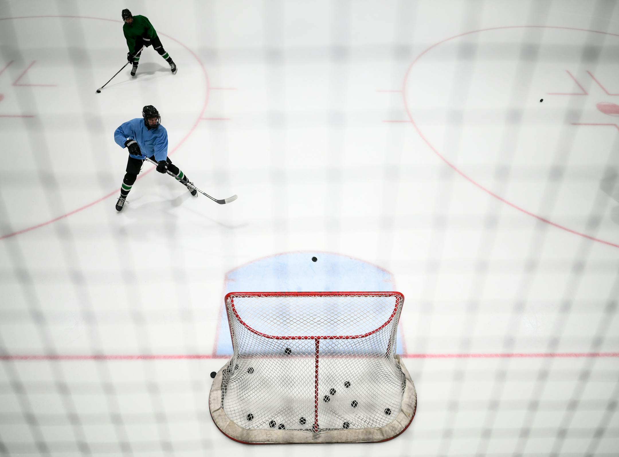 Rock Ridge players practice at the Iron Trail Motors Event Center Tuesday, Feb. 22, 2022 in Virginia, Minn.