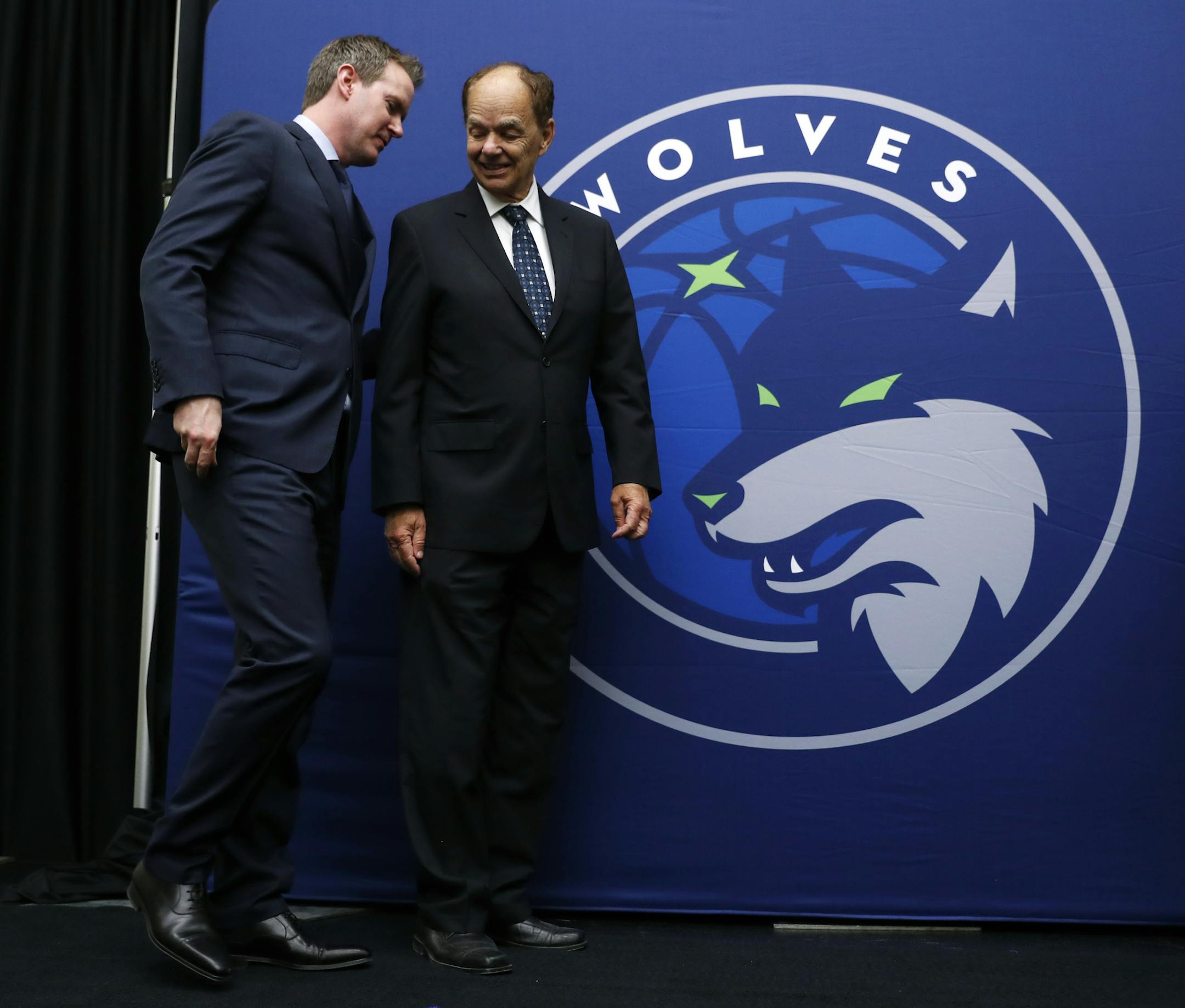 Minnesota Timberwolves CEO Ethan Casson, left, talks with Timberwolves majority owner Glen Taylor following a news conference, Tuesday, May 30, 2017, in Des Moines, Iowa. The Timberwolves, who recently purchased the Iowa Energy D-League franchise, unveiled their new affiliate's name, logo and colors. (AP Photo/Charlie Neibergall)