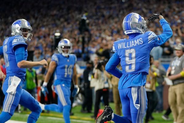 dDetroit Lions' Jameson Williams reacts after his touchdown catch uring the first half of an NFL football game against the Minnesota Vikings Sunday, D