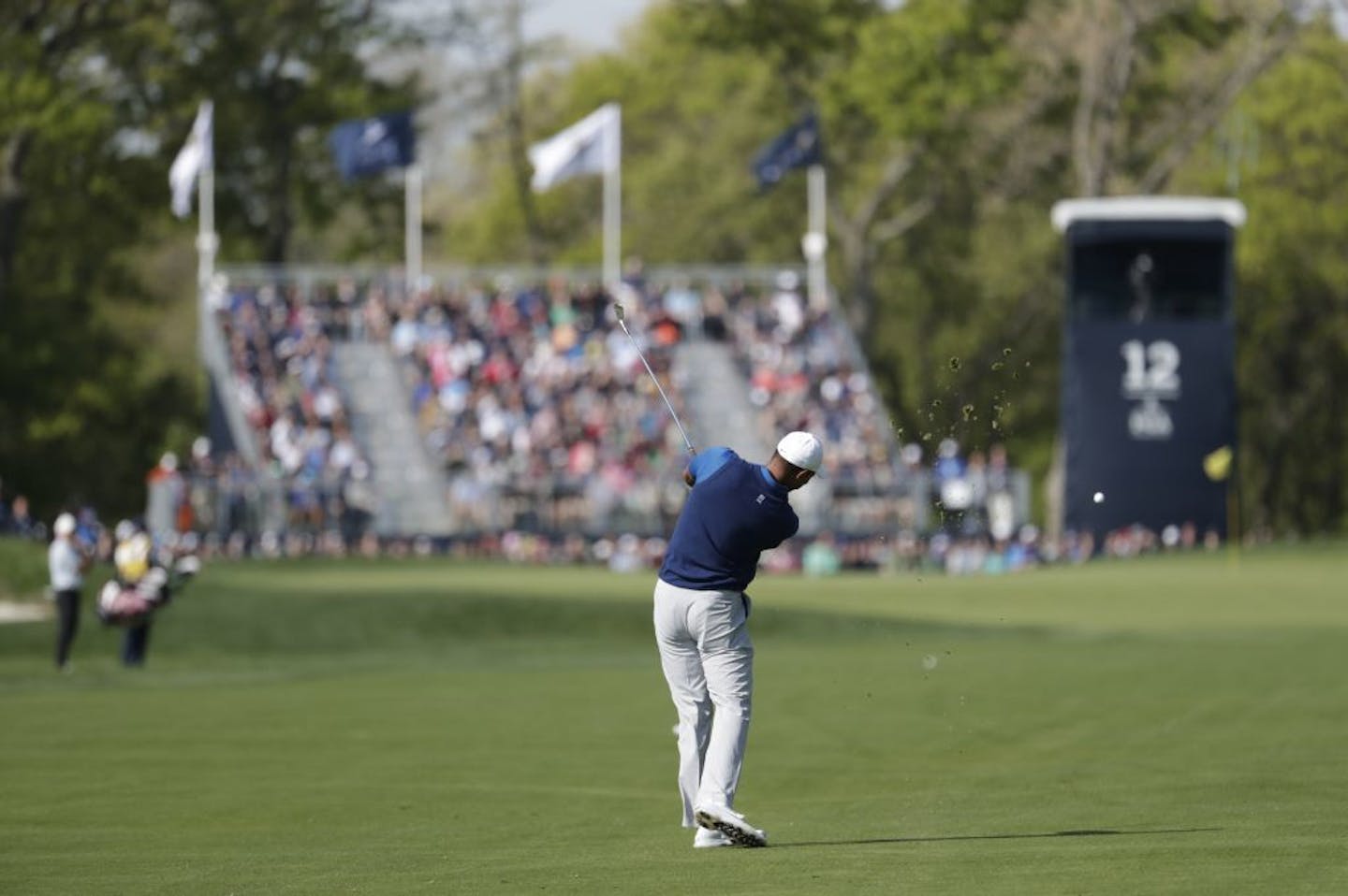 Tiger Woods hits onto the 12th green during the first round of the PGA Championship golf tournament, Thursday, May 16, 2019, at Bethpage Black in Farmingdale, N.Y.