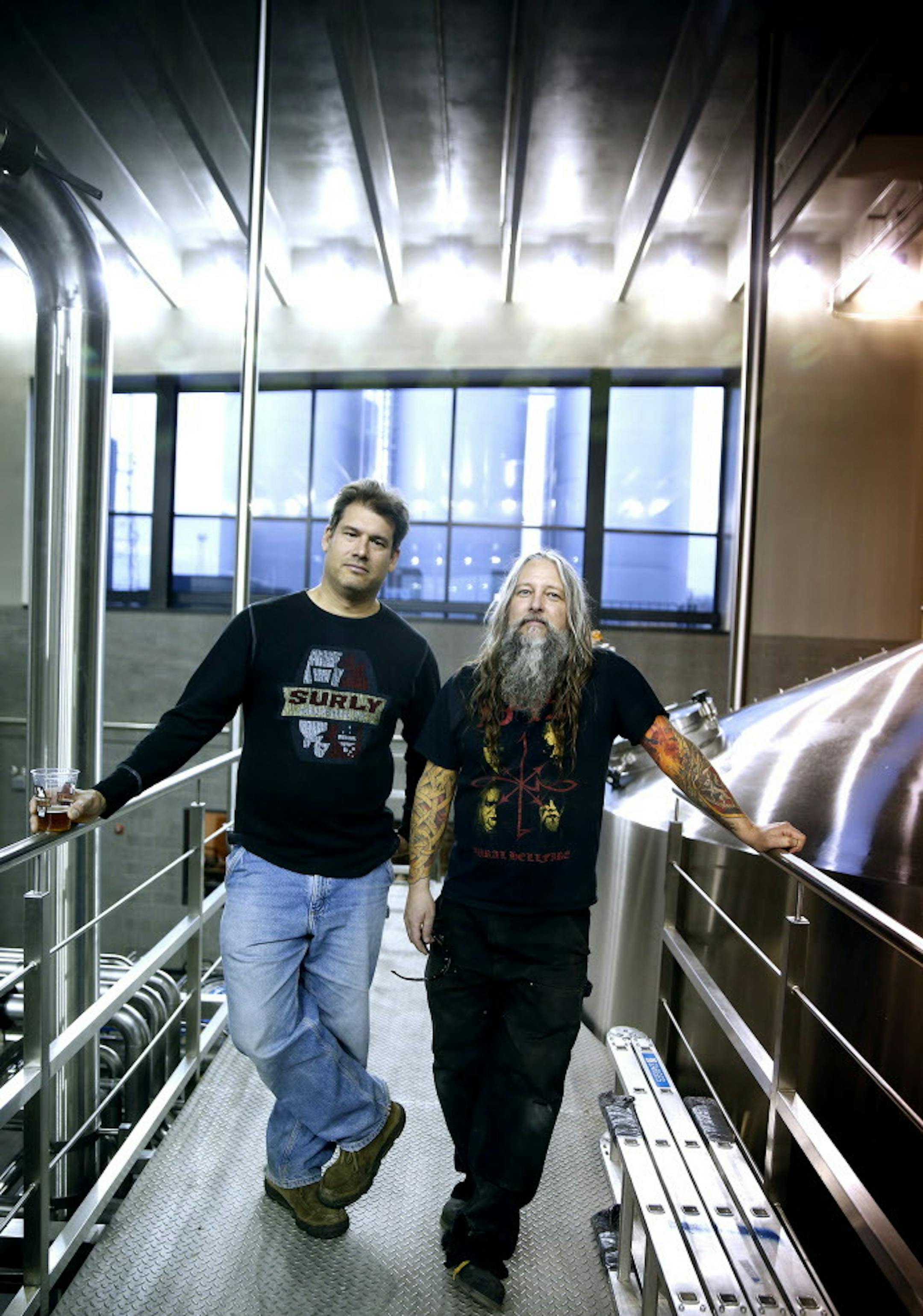 Surly Brewing Co.'s founder and president Omar Ansari, left, and brewery operations director Todd Haug inside their new brewery in southeast Minneapolis. ] LEILA NAVIDI leila.navidi@startribune.com / BACKGROUND INFORMATION: The new site of the Surly Brewing Co., expected to open in mid-December 2014, will offer brewery expansion by almost four times its current annual production. It will also include a beer hall and garden, a full-service restaurant and an event center.