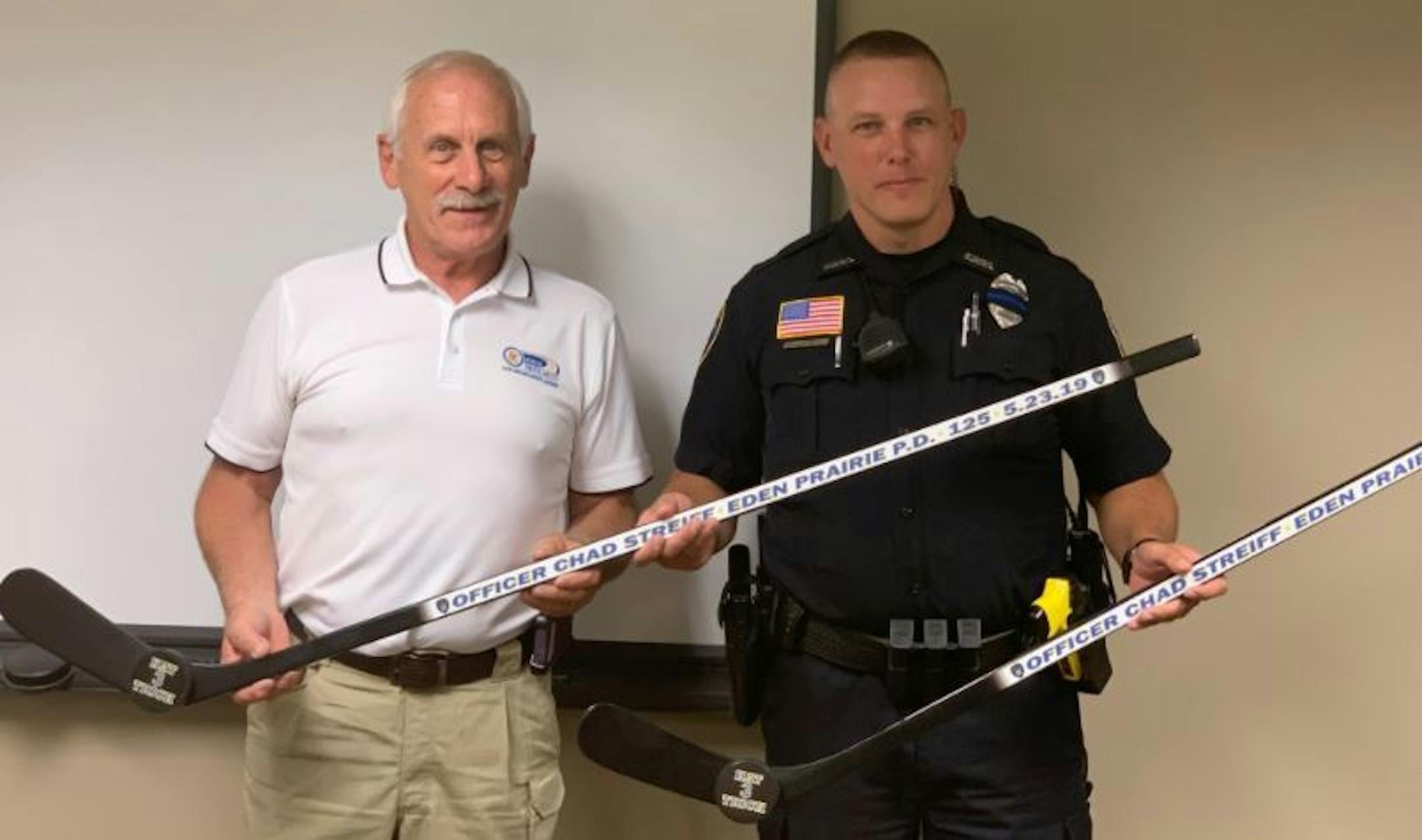 Officer Chad Streiff received two Hat Trick Awards from the Minnesota Department of Public Safety (DPS) for making three DWI arrests during his shifts in 2019 on May 23 and June 2. The award is a customized hockey stick with the officer's name, badge number and department on it. Credit: City of Eden Prairie