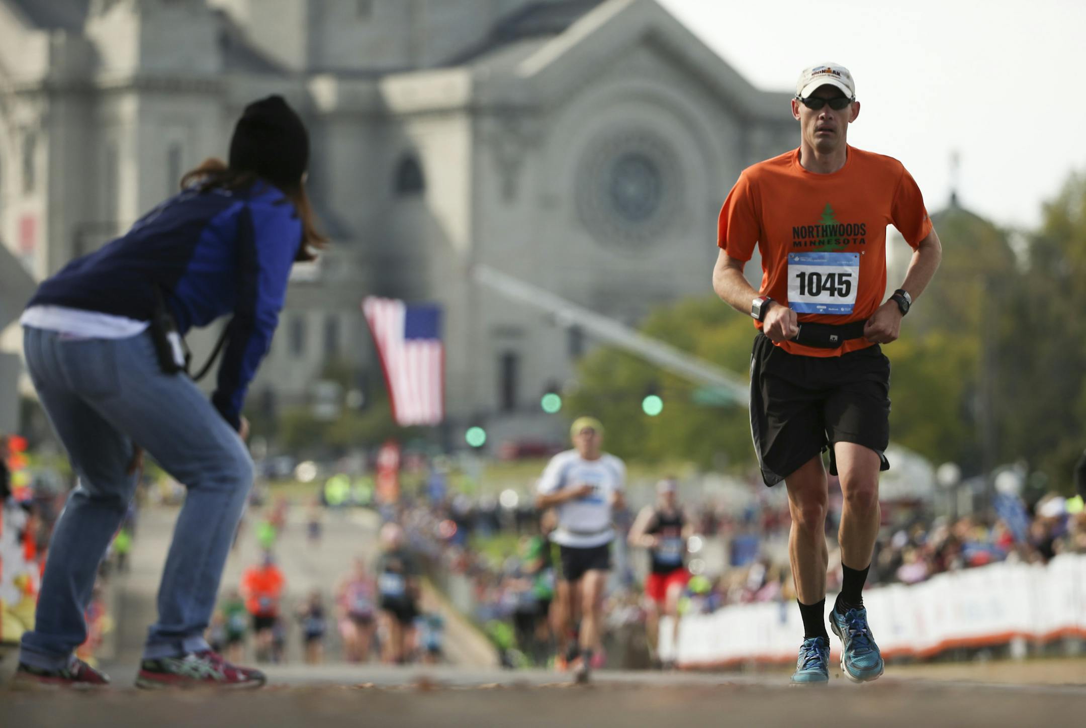 Chad Millner of Eden Prairie received encouragement from a race official just shy of the finish line Sunday morning.