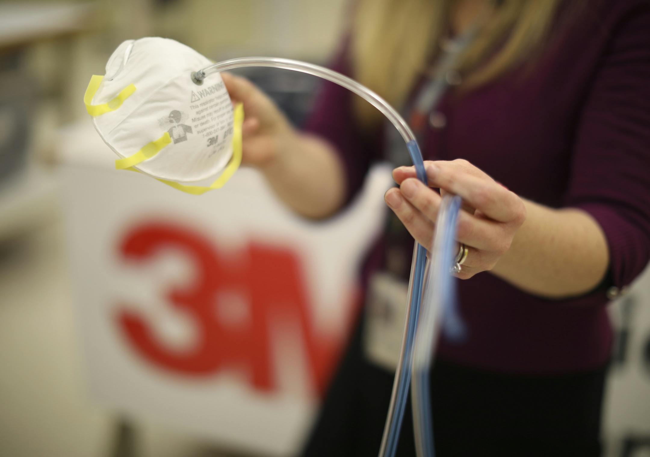 Nikki McCullough with a 3M dust protection mask. The hose coming out of it allows for testing for proper fit to ensure effectiveness. The hose facilitates measuring air samples inside and outside the mask. ] JEFF WHEELER ï jeff.wheeler@startribune.com 3M greatly expanded its safety products in June 2015 when it bought Capital Safety. We look at some of their new offerings during a visit to their safety products lab Thursday, February 16, 2017 at 3M's campus in Maplewood.