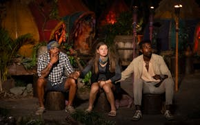 Eagan's Eva Erickson awaits to see who will win "Survivor" with Joe Hunter, left, and eventual winner Kyle Fraser.