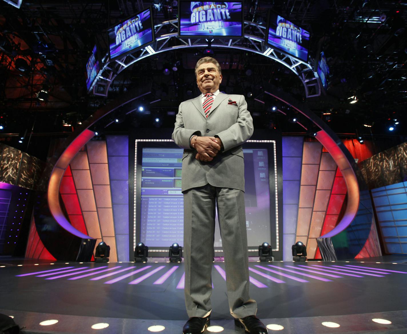 In this photo taken on Feb. 3, 2012, Chilean born host of the Univision network variety show "Sabado Gigante," Mario Kreutzberger, popularly known as Don Francisco, stands on the set of his show in Miami. Kreutzberger celebrates 50 years of hosting the show this year. (AP Photo/Wilfredo Lee) ORG XMIT: FLWL204