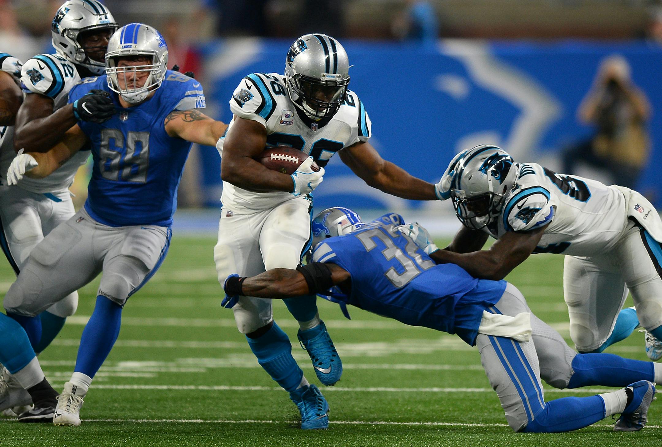Carolina Panthers running back Jonathan Stewart, middle, fights for yardage as Detroit Lions safety Tavon Wilson attempts to make the tackle in the first half on Sunday, Oct. 8, 2017, at Ford Field in Detroit. The Panthers won, 27-24. (Jeff Siner/Charlotte Observer/TNS)