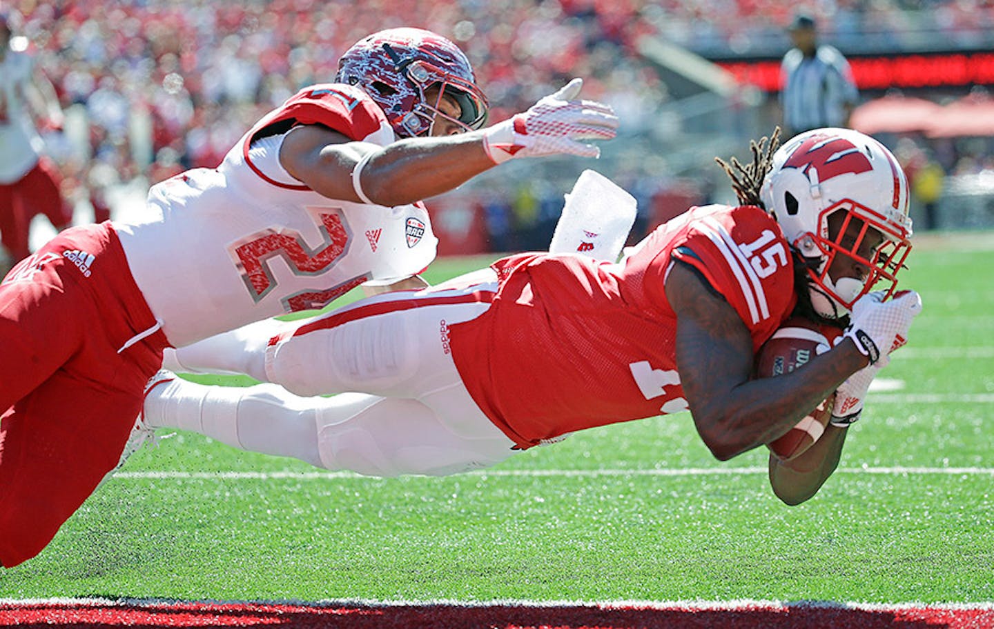 Wisconsin's Robert Wheelwright, right, catches a touchdown pass in front of Miami of Ohio's Heath Harding during the first half of an NCAA college football game, Saturday, Sept. 12, 2015, in Madison, Wis.