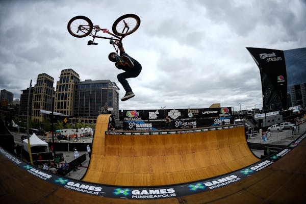 British BMX rider Jamie Bestwick performed a tail whip as he launched out of the vert ramp during practice Thursday afternoon outside US Bank Stadium 