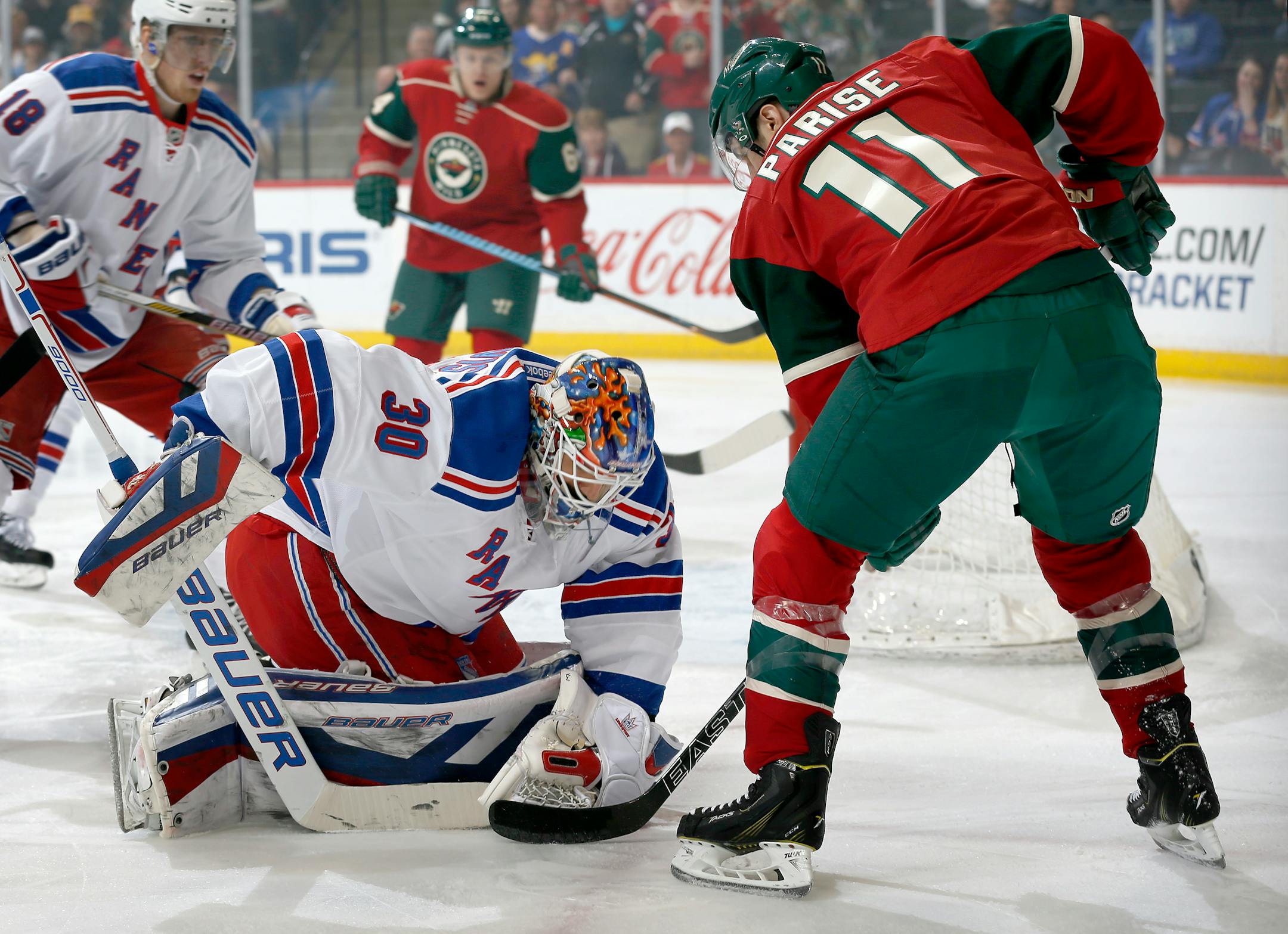 Rangers goalie Henrik Lundqvist (30) made a save against Zach Parise (11) in the first period.