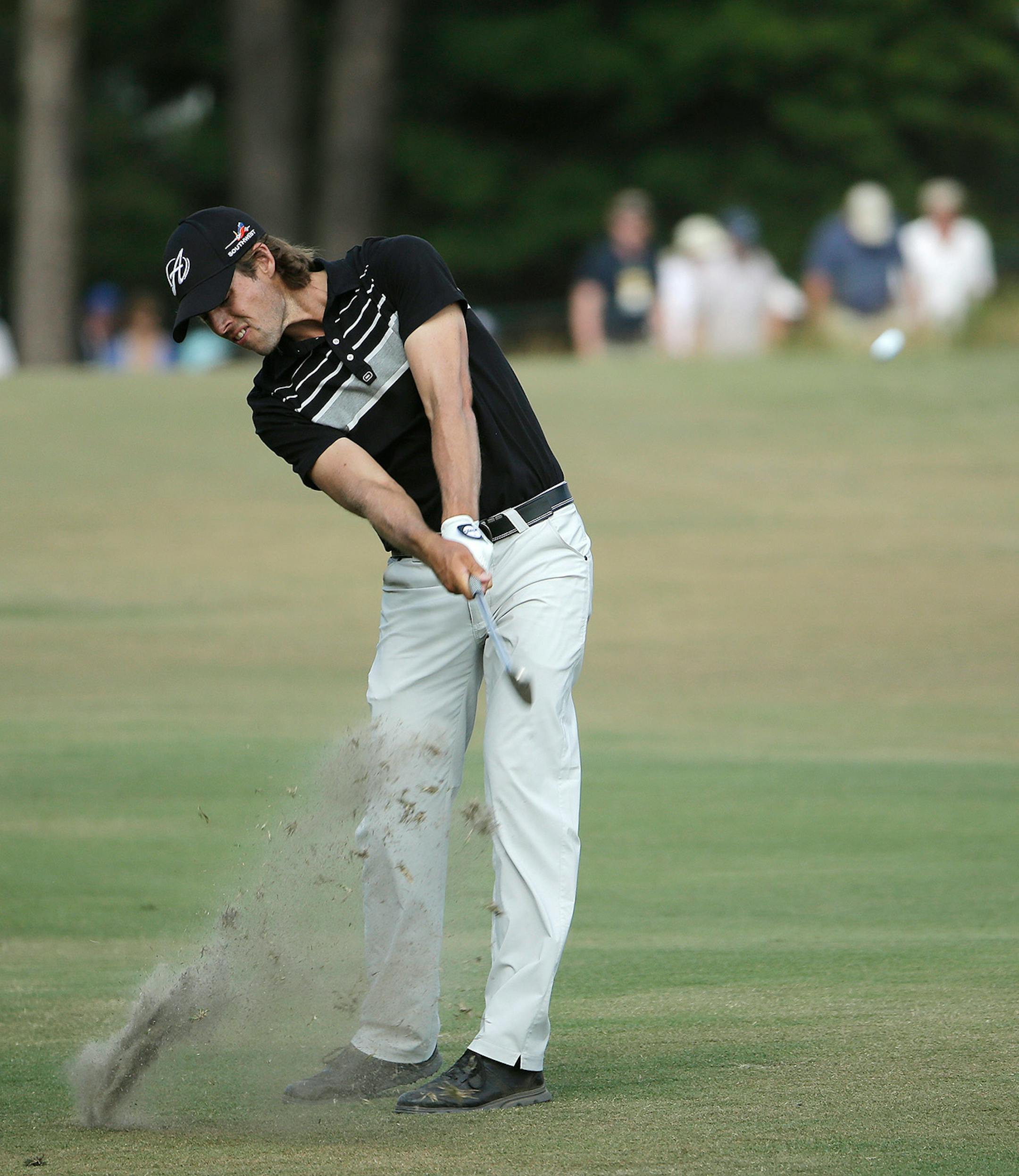 Aaron Baddeley, of Australia, hits from the fairway on the 18th hole during the third round of the U.S. Open golf tournament in Pinehurst, N.C., Saturday, June 14, 2014.