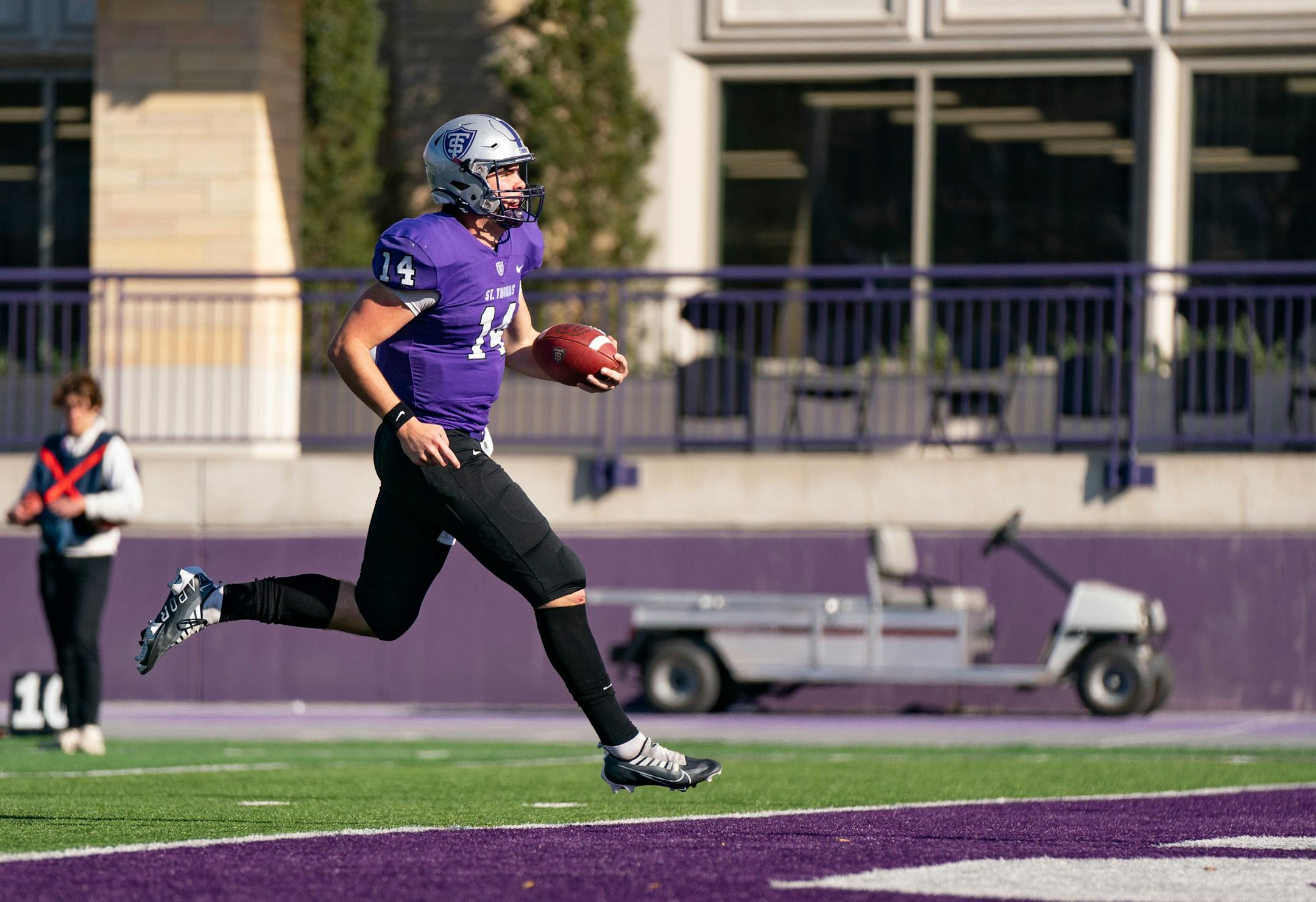 St. Thomas quarterback Cade Sexauer (14) scores a rushing touchdown against San Diego.