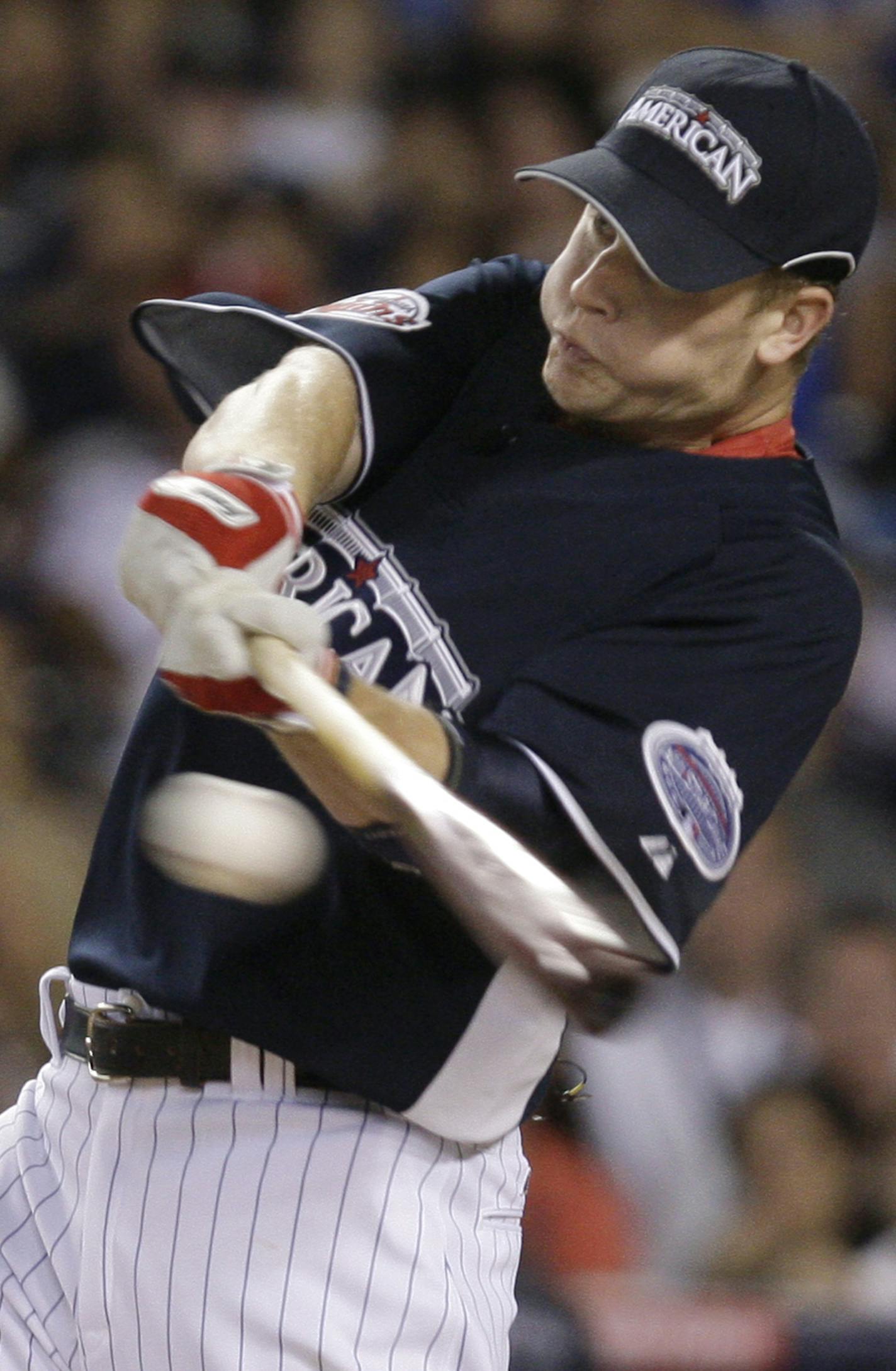 Minnesota Twins' Justin Morneau swings at a pitch at the Major League Baseball All-Star Home Run Derby at Yankee Stadium in New York on Monday, July 14, 2008. (AP Photo/Julie Jacobson) ORG XMIT: NYY128