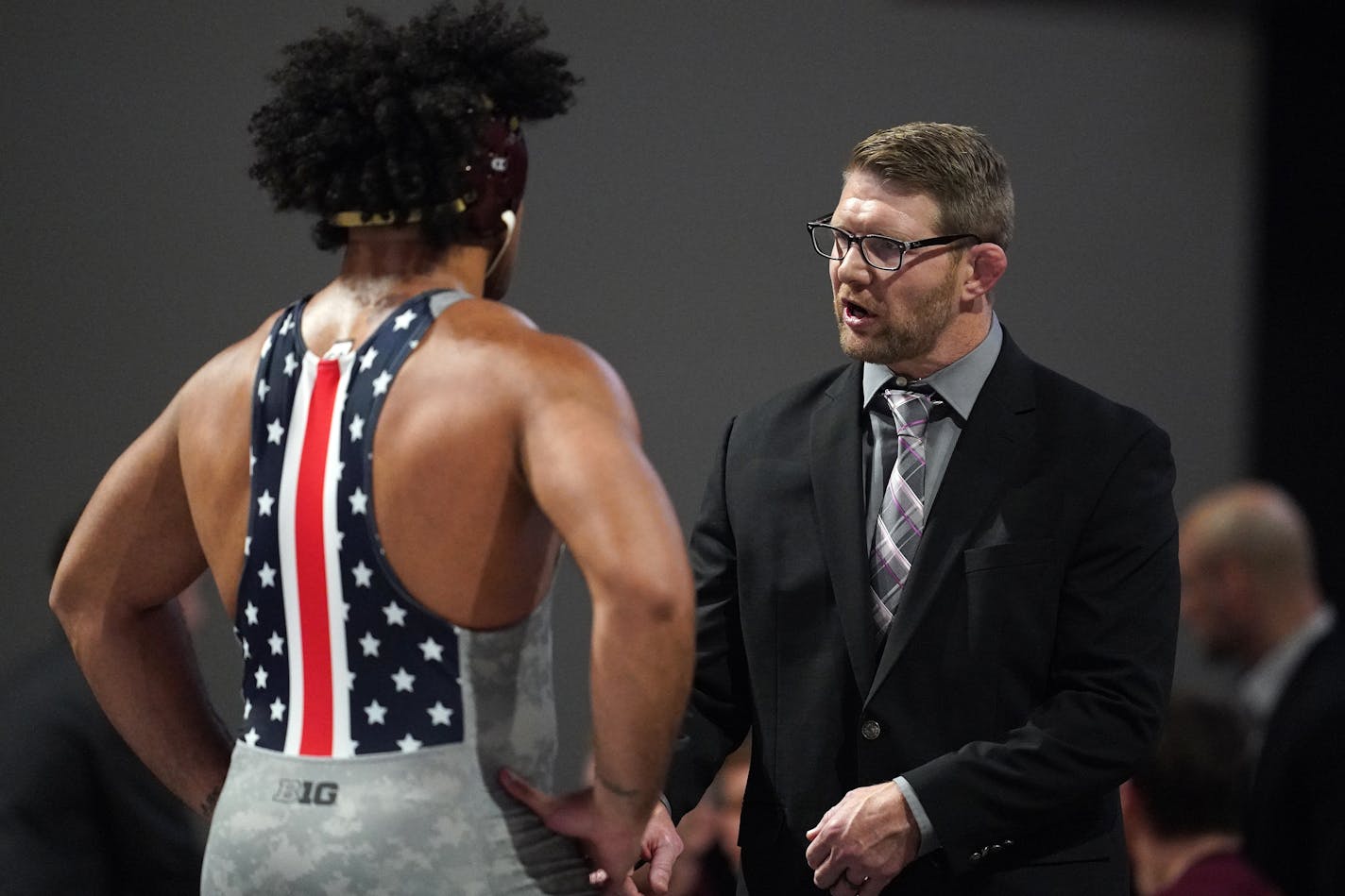 Minnesota's Gable Steveson talked with coach Brandon Eggum during a match last season vs. Wisconsin.