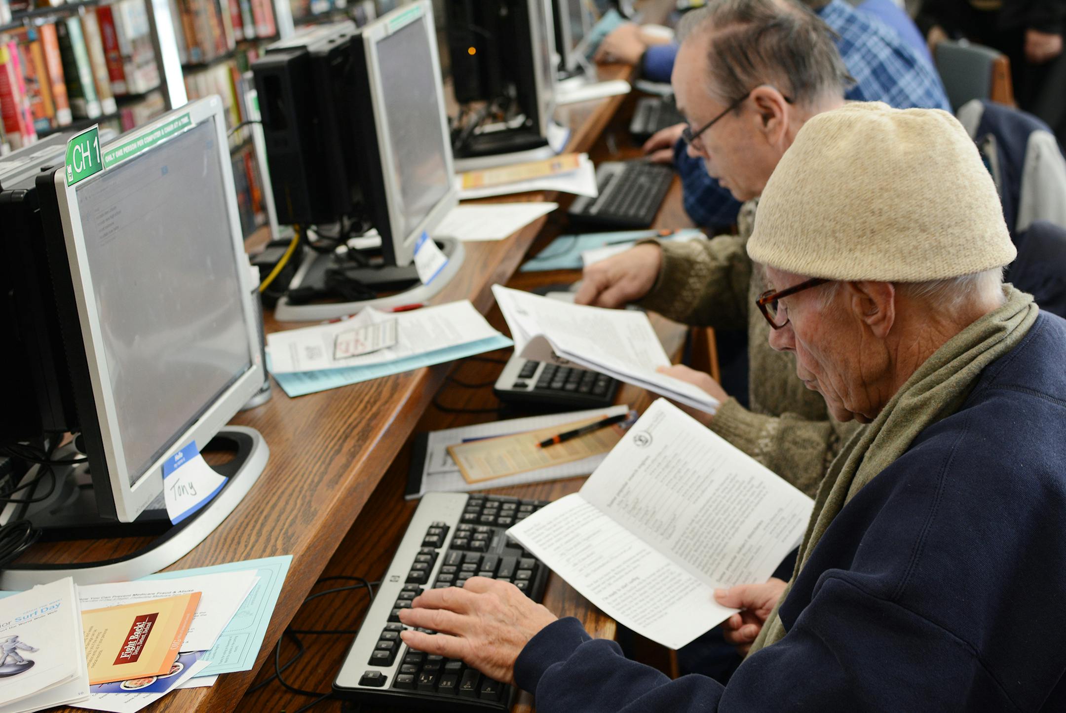 Elton Carlson, of Columbia Heights, (front) and Stephen Weselenak, of Minneapolis, (back) searched for information online during Senior Surf Day at the Columbia Heights Public Library. Photo by Liz Rolfsmeier, Special to the Star Tribune