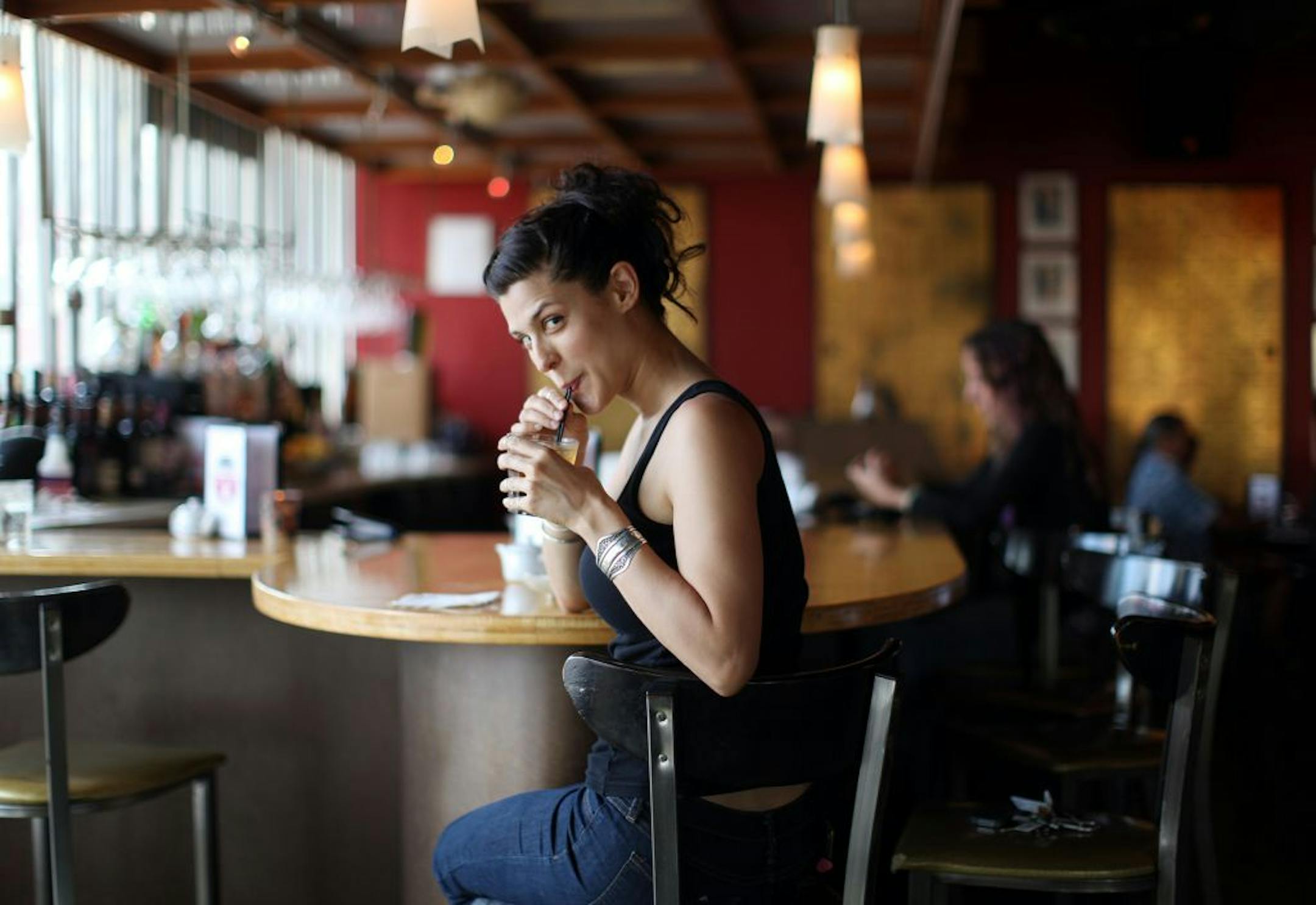 Local rapper/ singer Dessa Darling sipped on her favorite drink, a black belt, at her usual spot on the bar at Fuji-Ya in Minneapolis, Minn., Sunday, July 10, 2011.