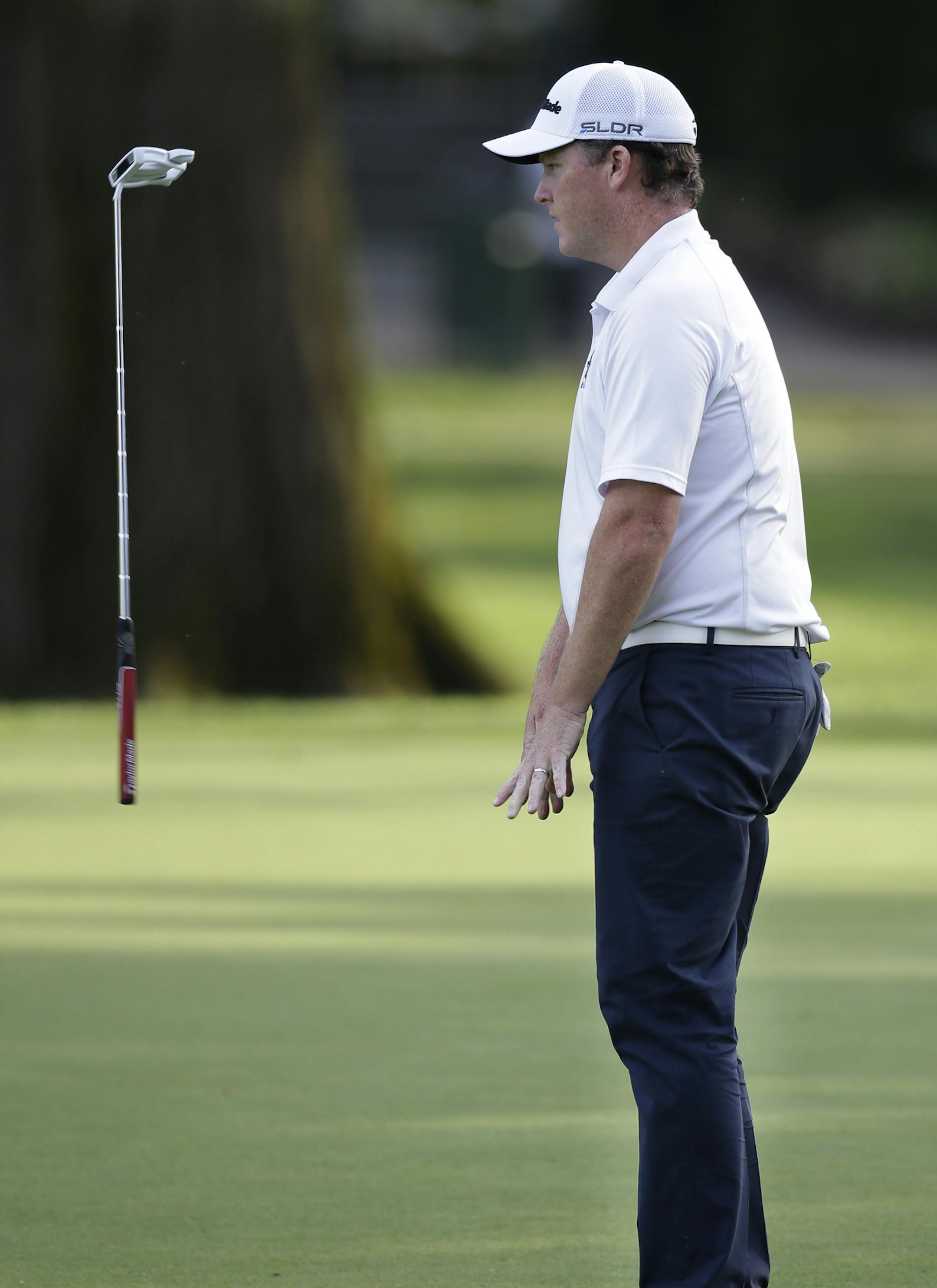 Marcus Fraser, of Australia, reacts after missing a birdie putt on the ninth hole during the second round of the PGA Championship golf tournament at Oak Hill Country Club, Friday, Aug. 9, 2013, in Pittsford, N.Y. (AP Photo/Charlie Neibergall)