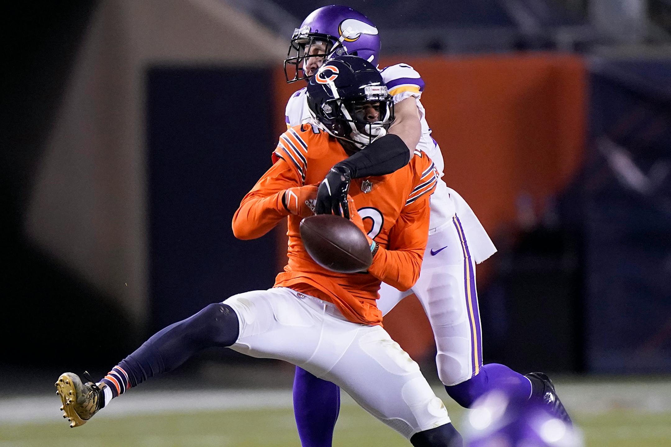 Chicago Bears wide receiver Allen Robinson II, front, has a pass broken up by Minnesota Vikings safety Harrison Smith during the second half of an NFL football game Monday, Nov. 16, 2020, in Chicago. (AP Photo/Nam Y. Huh)