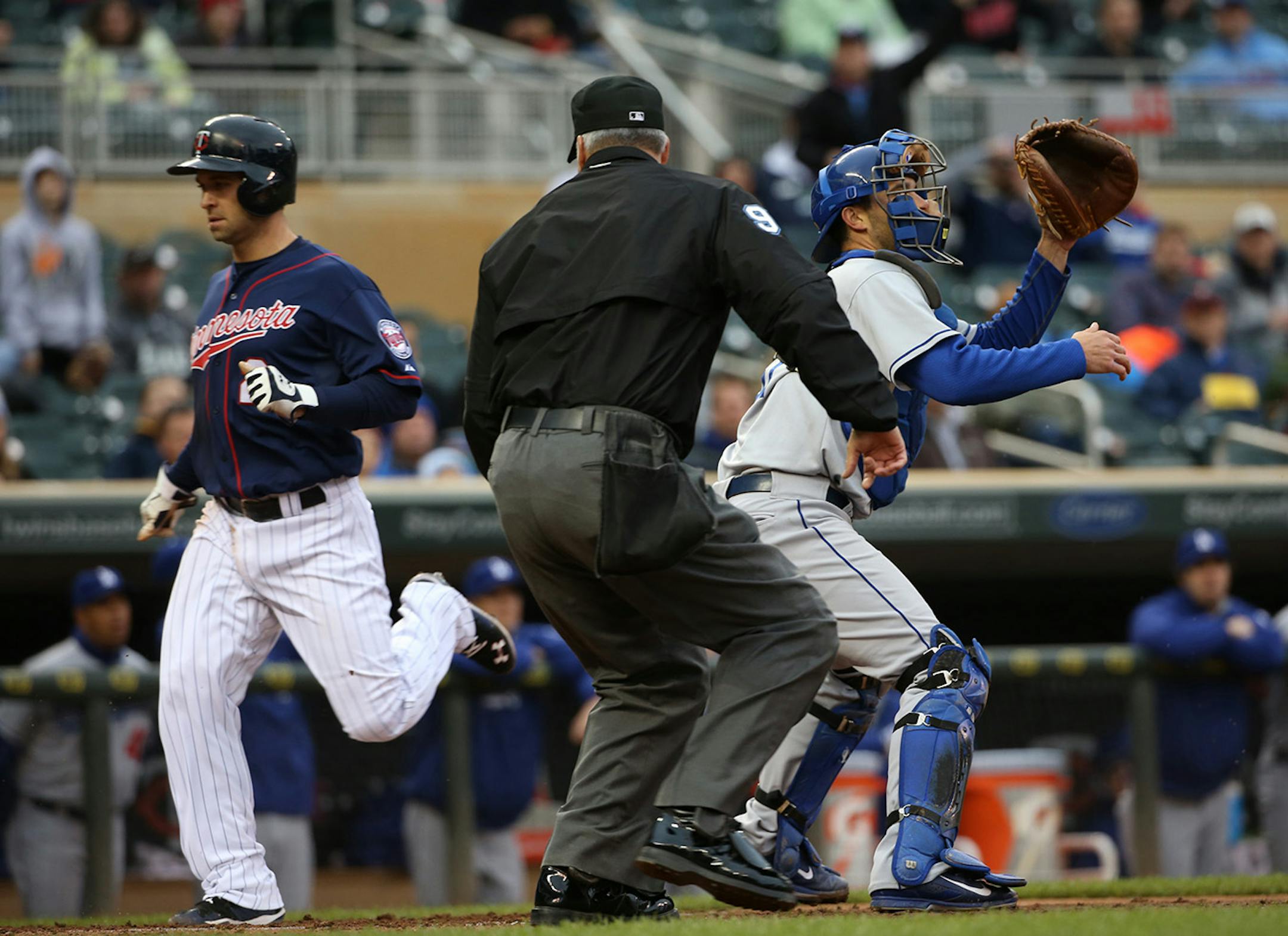 Twins Brian Dozier scored the first run of the second game in the first inning.