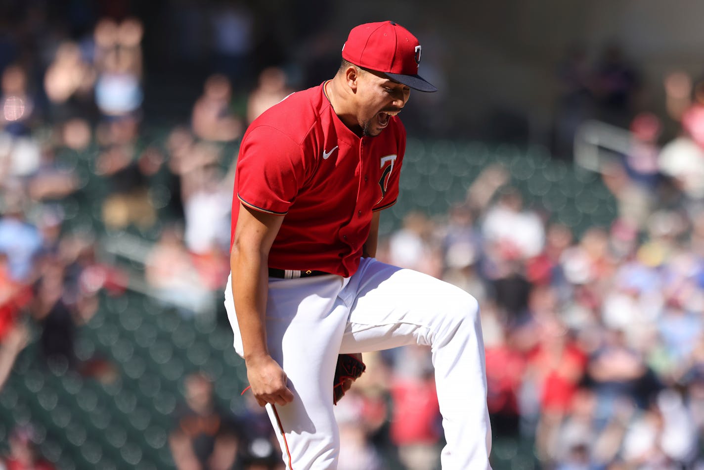 Minnesota Twins relief pitcher Jhoan Duran (59) reacts after striking out Oakland Athletics Christian Bethancourt (23) to win the game 1-0 during the ninth inning of a baseball game Saturday, May 7, 2022, in Minneapolis. (AP Photo/Stacy Bengs)