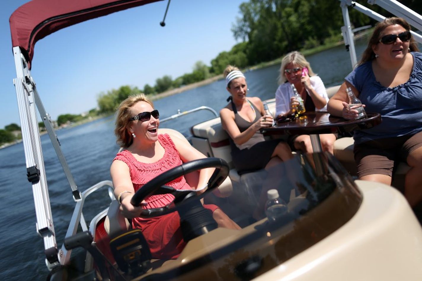 From left, Chris Dicke, Tami Tushie, Jodi Bianchi and Amanda Blotsky spent a recent afternoon on Prior Lake. Many women are finding that rentals let them get out on a boat without the hassles of ownership.