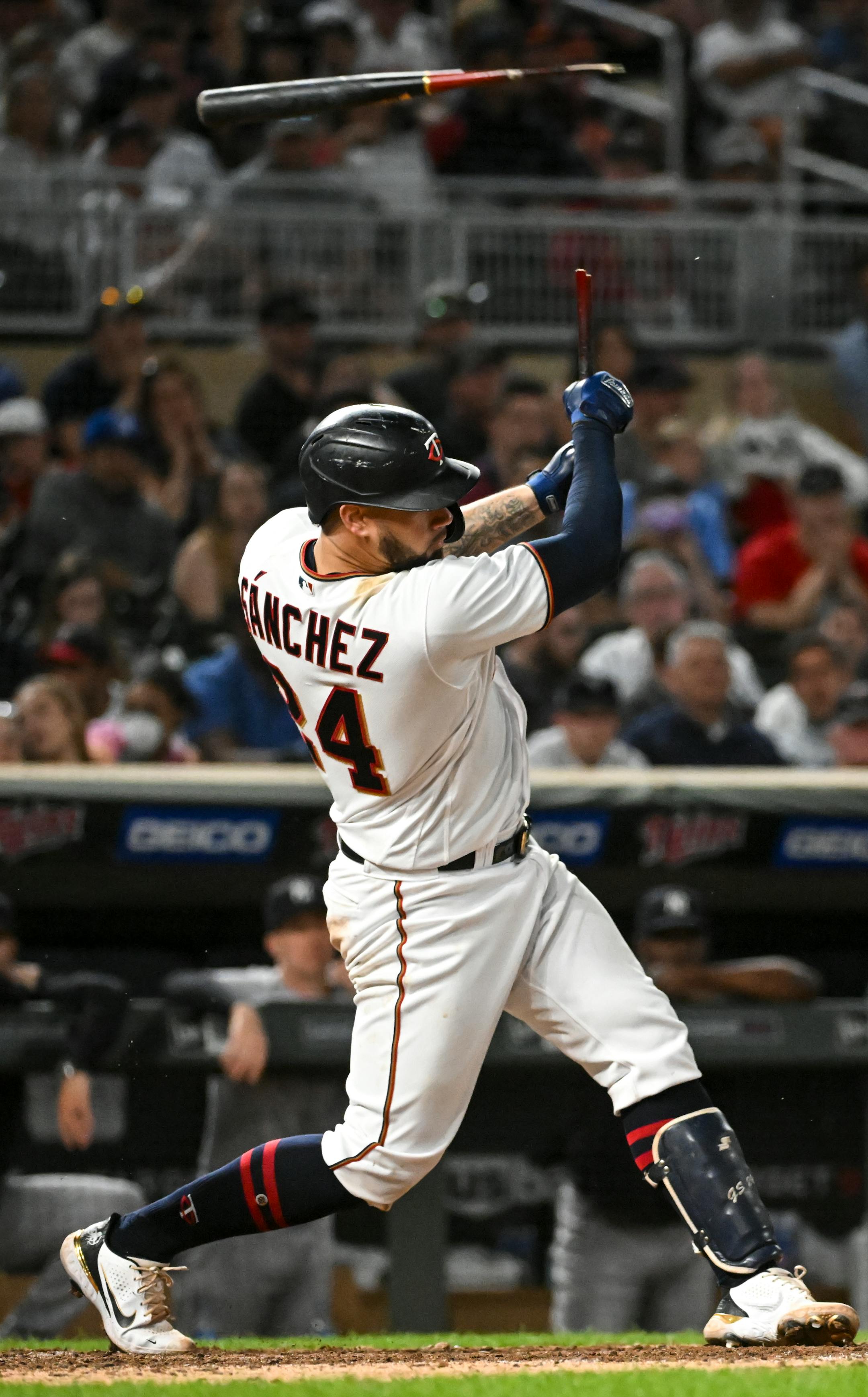 Minnesota Twins catcher Gary Sanchez (24) breaks his bat as he grounds out in the bottom of the seventh inning against the New York Yankees.