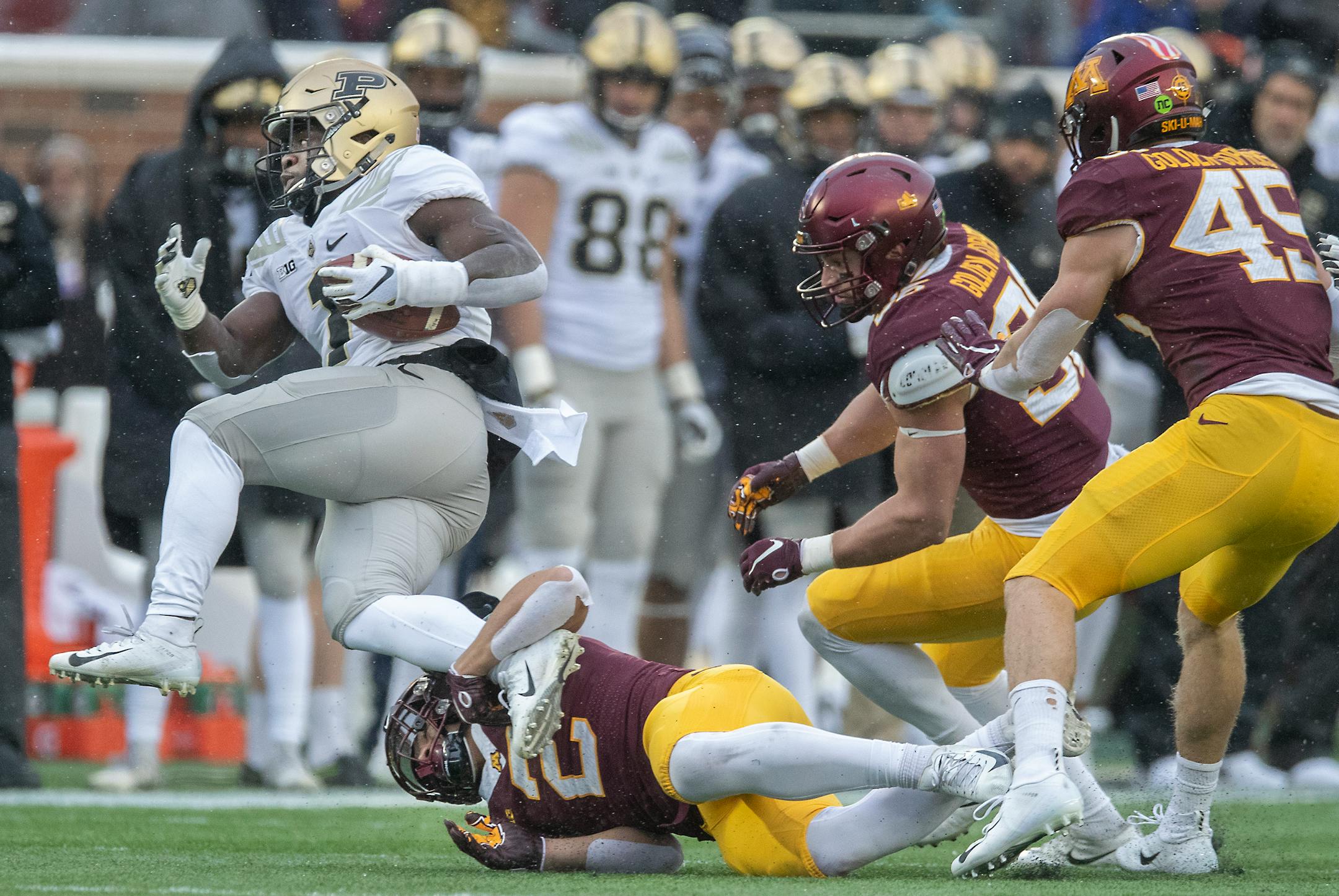 Minnesota defensive back Jacob Huff stopped Purdue running back D.J. Knox during the second quarter