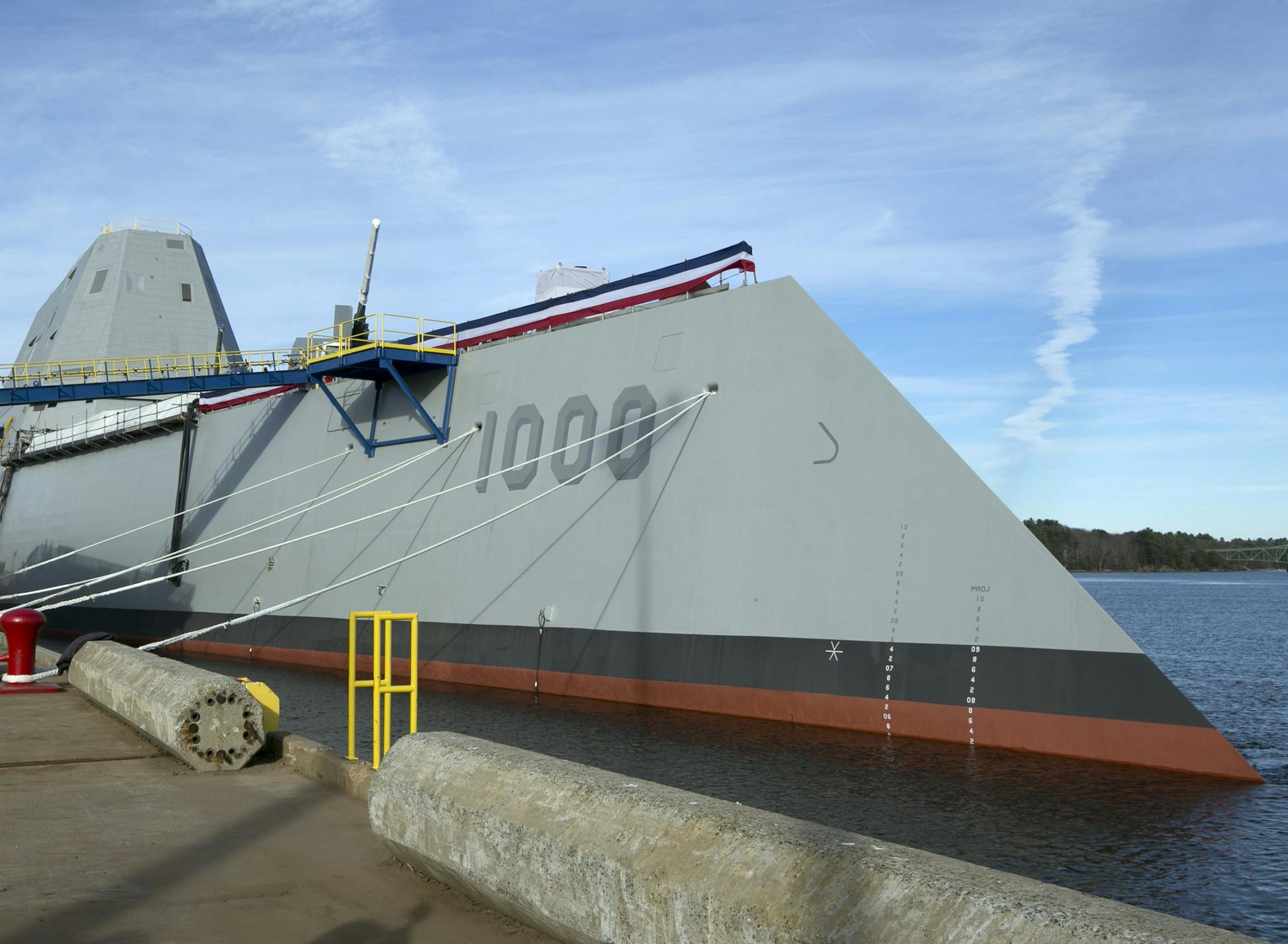 FILE - In a Thursday, Oct. 31, 2013 file photo, the Navy's stealthy Zumwalt destroyer is moored at Bath Iron Works, in Bath, Maine. The skipper of the technology-laden Zumwalt is Capt. James Kirk, and his futuristic-looking vessel sports cutting-edge technology, new propulsion and powerful armaments, but this ship isnít the Starship Enterprise. The technology-laden Zumwalt taking shape at Maineís Bath Iron Works is unlike any other U.S. warship. (AP Photo/Robert F. Bukaty, File)
