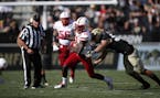 Nebraska Cornhuskers wide receiver JD Spielman (10) is tackled by Colorado Buffaloes linebacker Nate Landman in the second half overtime of an NCAA co