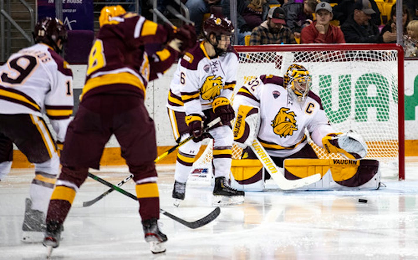 UMD goaltender Hunter Shepard (32) made a save with his leg pad in the third period. Shepard pitched a shutout on the night.    ]